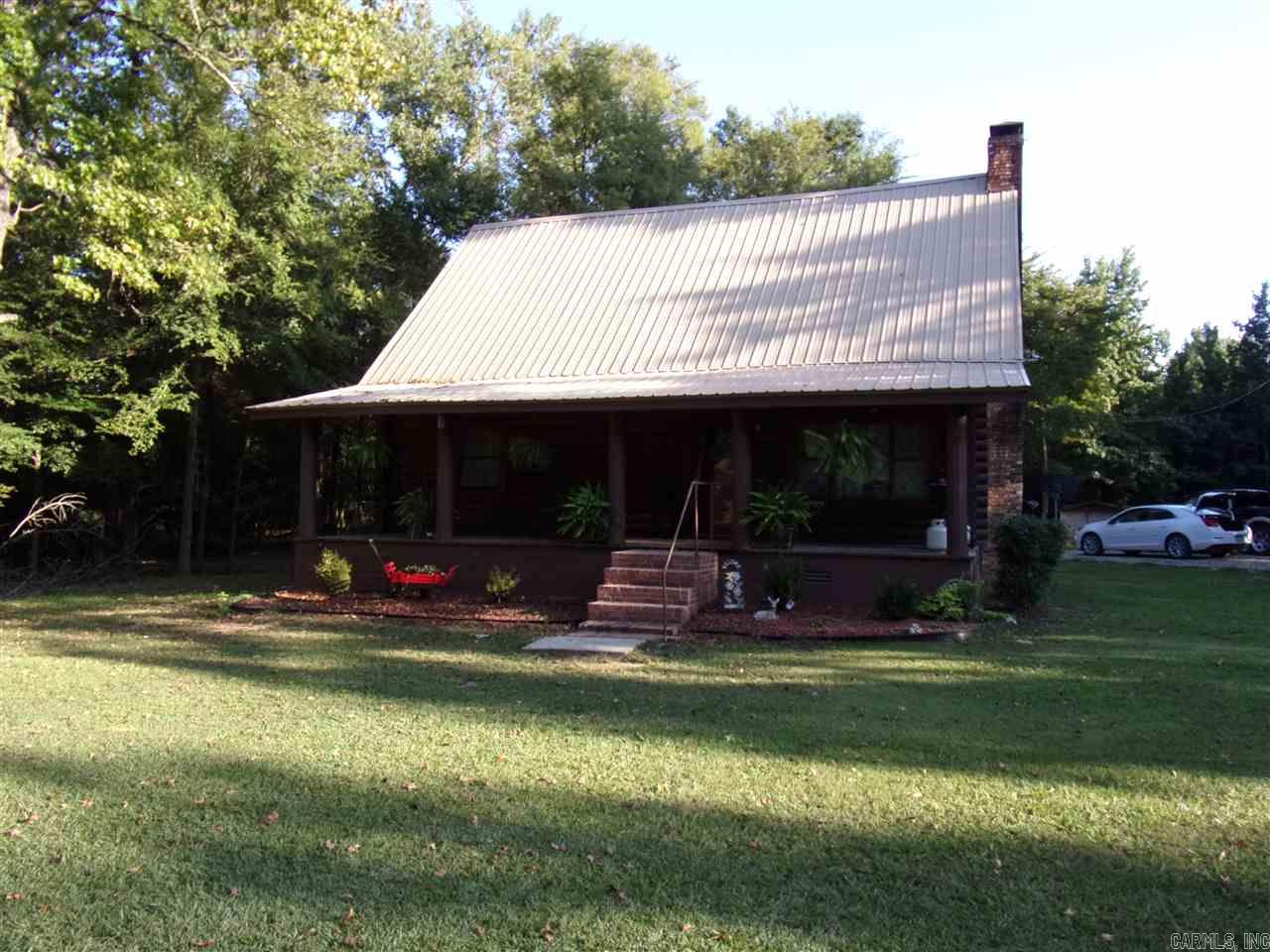 Beautiful log cabin sitting on 31 acres right off the highway. Logs have been completely re-varnished. This cabin gives you that WOW factor. Plenty of deer roam the tree covered property. Nice fishing pond stocked with fish. Work shop with 391 sq.ft. Very nice basement with 668 sq. ft. not included in the living area sq. ft.