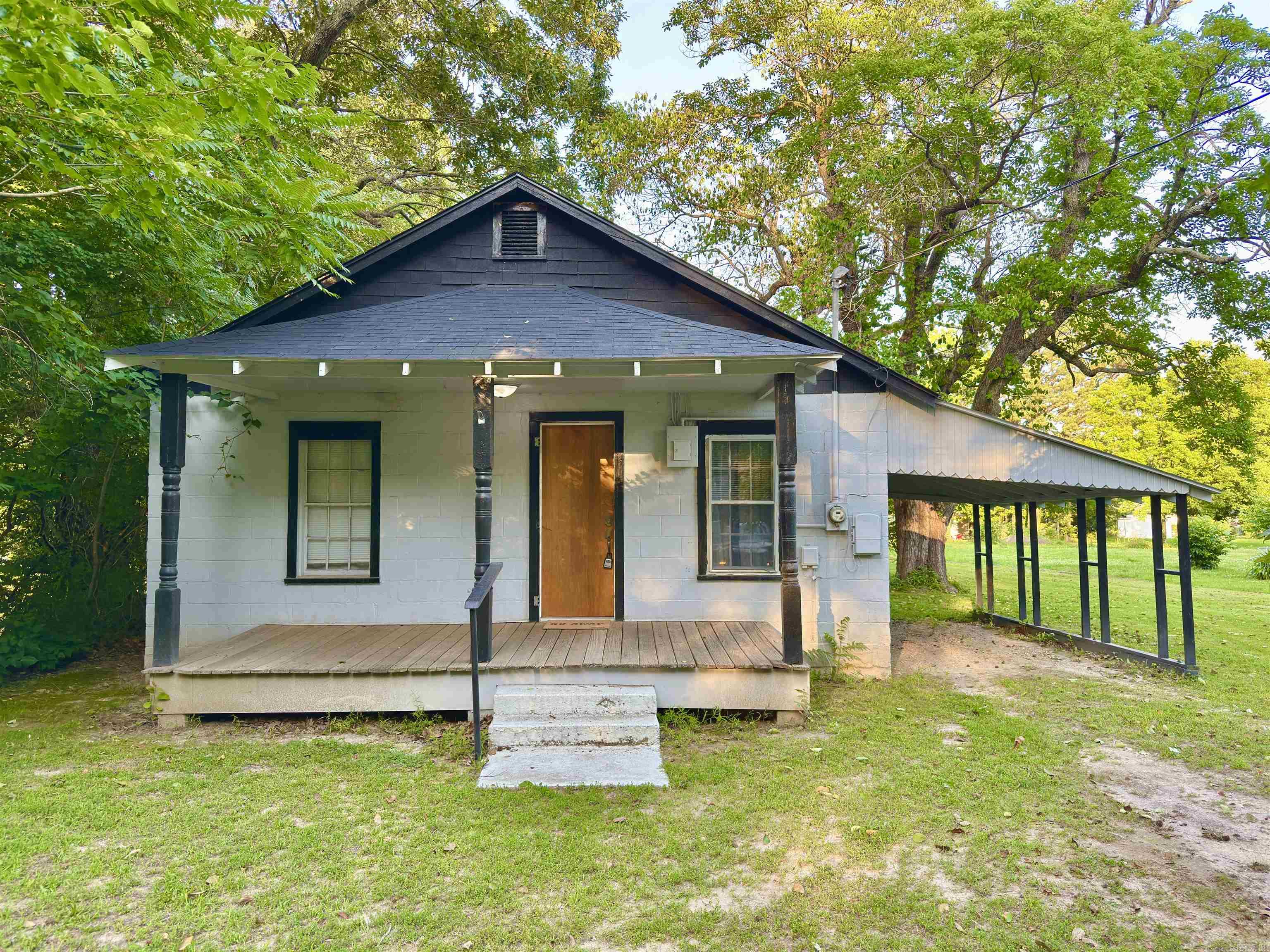 Investor opportunity selling at auction! This 2 bedroom, 1 bath home offers approximately 672 square feet of living space on a 0.63± acre lot and is conveniently located just minutes from downtown Piggott.  The home features a clean, move-in ready appearance, utility room, front porch, carport, and additional parking area. Mature trees provide shade throughout the spacious yard, while two outbuildings offer additional storage and utility space.  Whether you're seeking a rental property, investment opportunity, or affordable residence, this property offers a variety of possibilities. Conveniently located near local shopping, dining, schools, and community amenities.  This property is being offered at online auction. For additional information regarding the property or auction Terms and Conditions, please contact our office at 870-236-6117 or visit SOLDasap.com.