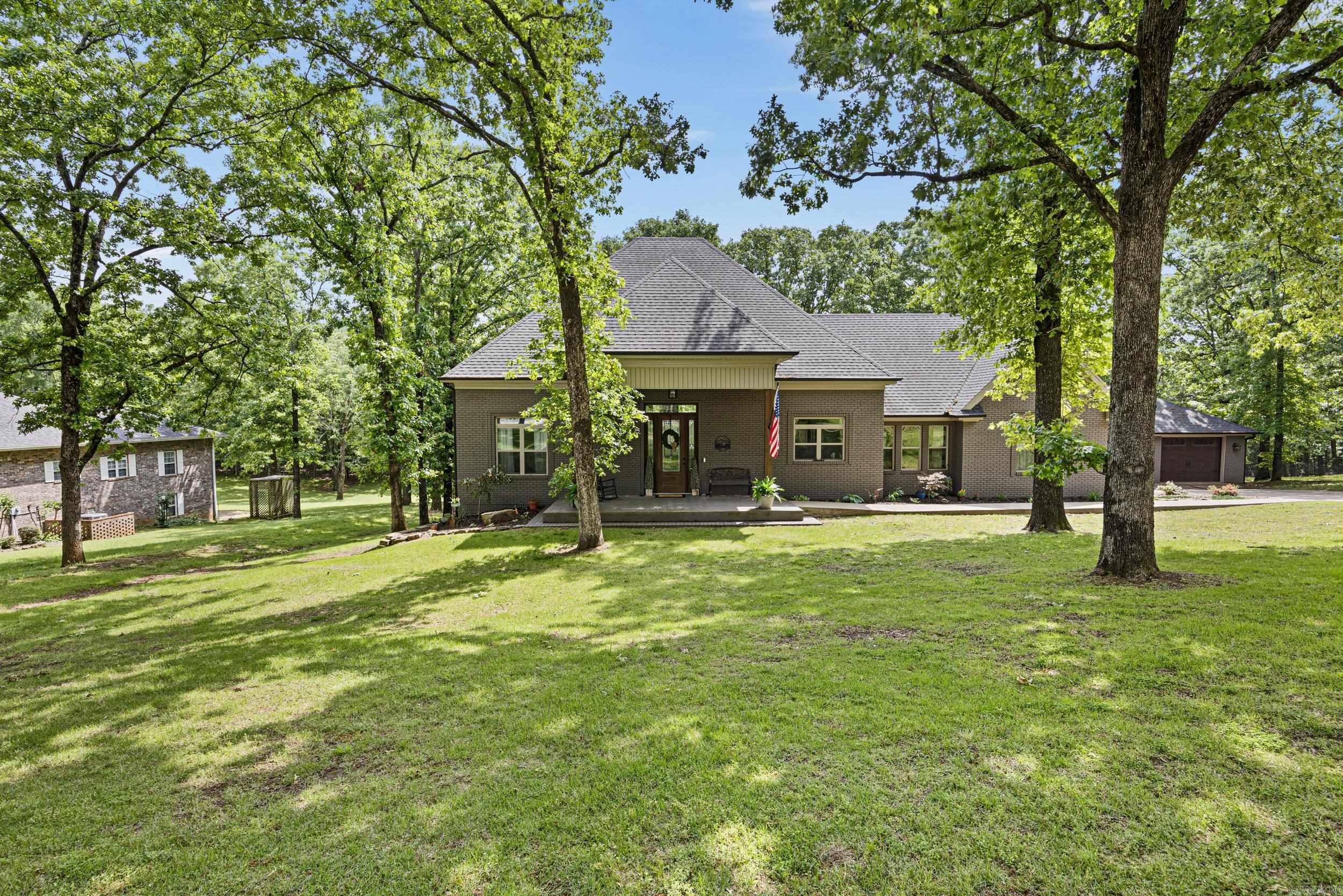 Welcome to this stunning 3-bedroom, 3-bath home nestled on 1.1 acres in the desirable Rosemary Estates. From the moment you step inside, you’ll be captivated by the soaring 12-foot tongue-and-groove wood ceilings and rich oak hardwood flooring that flow throughout the main living area, creating a warm yet elegant atmosphere. The kitchen is a true showstopper, featuring gorgeous quartzite countertops, a brass farmhouse sink, and a dedicated gas cooktop—perfect for both everyday living and entertaining. The spacious master suite offers cathedral ceilings and an adjoining flex space ideal for a private office or cozy reading nook. The luxurious en-suite bath includes a large walk-in tiled shower designed for relaxation. Step outside to enjoy the peaceful, oversized back deck overlooking the expansive backyard—perfect for morning coffee or evening gatherings. Downstairs, you’ll find an additional 600 sq ft flex room complete with its own full bathroom, offering endless possibilities for a guest suite, media room, or home gym. This home is packed with thoughtful features including gigabit fiber optic internet, a full walk-through attic for easy storage, a French drain system, fully g