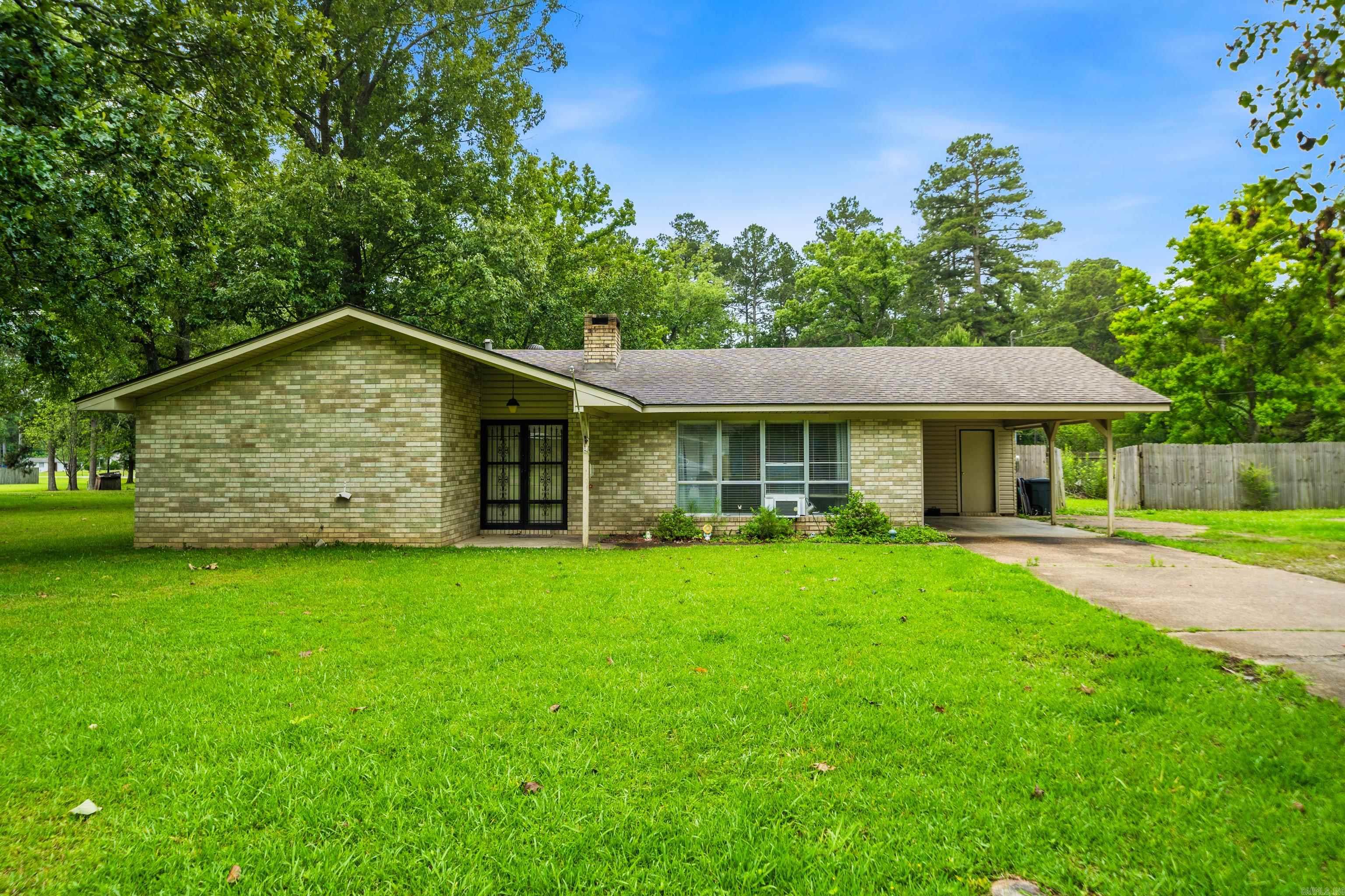 *Small Town Charm*  Packed with potential and sitting on a flat double lot, this 3-bedroom, 2-bath home built in 1976 offers space, character and opportunity! Located on a quiet street while still being close to everything town has to offer, this property has so much to appreciate. The living area features vaulted ceilings that create an open, airy feel, along with a fireplace that was recently inspected for peace of mind. Enjoy the added bonus of an enclosed patio, fenced backyard and an outdoor storm shelter. Updates include a new roof in 2021 and HVAC serviced in 2026.  It’s a fantastic opportunity for a home buyer wanting to build equity or an investor looking for their next project. With great bones, a spacious lot, and valuable updates already completed, this property is full of possibilities!
