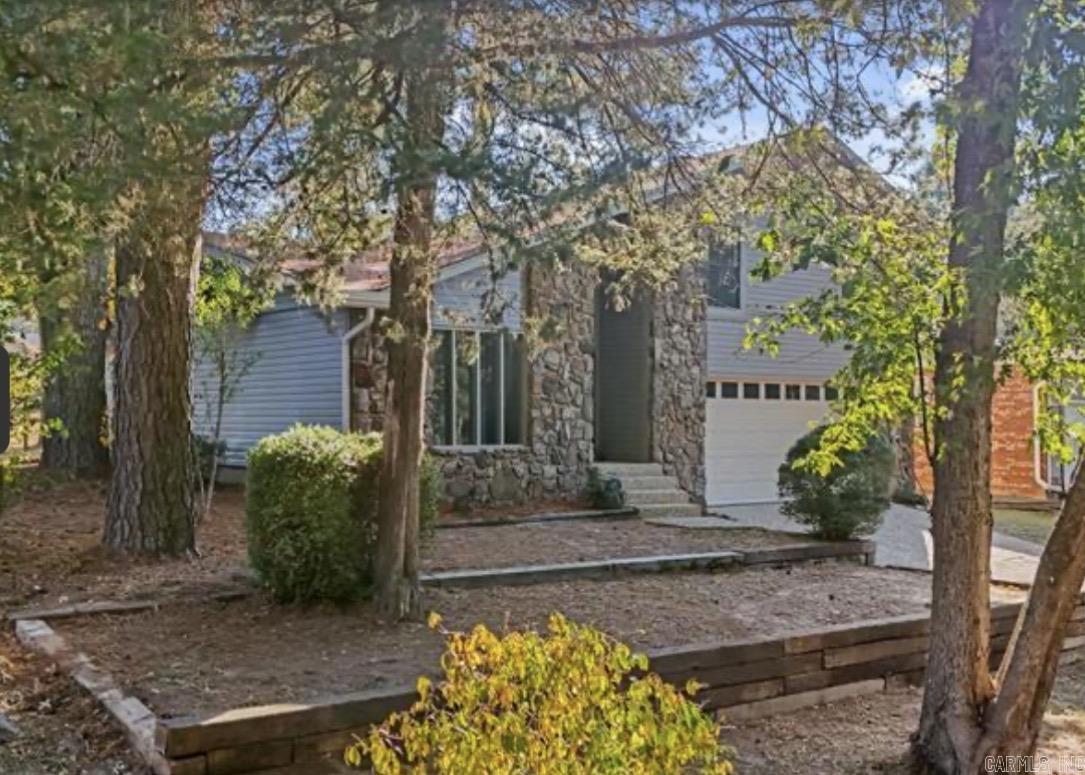 If you're looking for a home that's already done, this is it! Renovated just two years ago, this 3-bedroom, 2.5-bath split-level combines modern updates with comfortable living. Enjoy a vaulted great room with a fireplace and wet bar, a private office, quartz countertops, luxury vinyl flooring, and updated appliances. The primary suite offers a walk-in closet, walk-in shower, and its own private deck. Washer, dryer, and refrigerator all stay, making your move even easier. Located close to shopping, dining, and everyday conveniences.