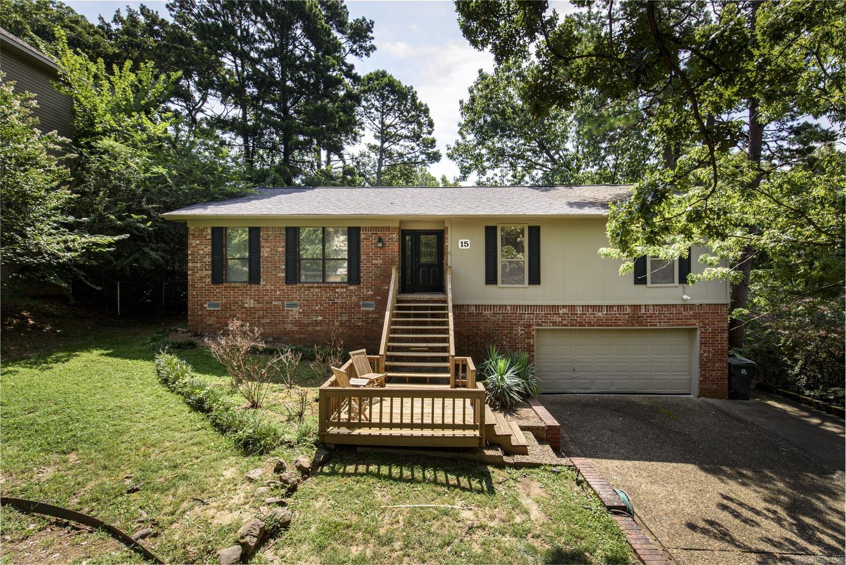 This fabulous home sits on a quiet tree shaded cul de sac in the heart of west Little Rock.  Move in ready with so many updates, this immaculate home has great flow and spacious rooms. Beautiful vinyl flooring, two bright sun filled living spaces and wonderful kitchen with concrete counters, tile backsplash, dry bar and newer Samsung appliances.  Lots of windows bring the outside in.  Two connecting decks for easy outdoor entertaining. Oversized garage.  Fenced backyard.