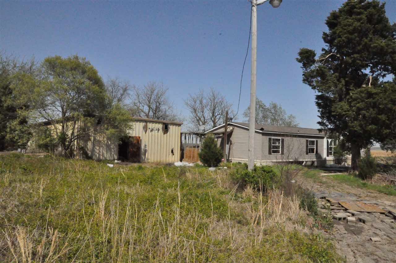 Investment property on one acre.  Mobile home is in need of refurb and is as-is where is.  Property is as-is.