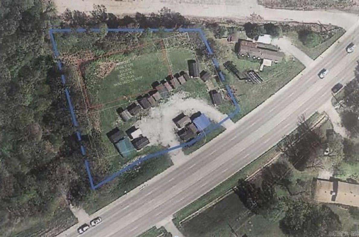 Zoned HC - Highway Corridor Commercial District. Approximately 270' of frontage on Highway 49/Linwood Drive in a high traffic area, within Paragould city limits. 20,361 estimated daily traffic counts from 2022. Two adjoining lots total approx. 1.19 acres. Suitable location and land for office, retail, medical, etc.  Currently used to sell portable buildings - the property is NOT under a lease and there are NOT permanent structures on the property.  Possible owner financing for a gap period while a buyer obtains more permanent financing, similar to an option to buy.