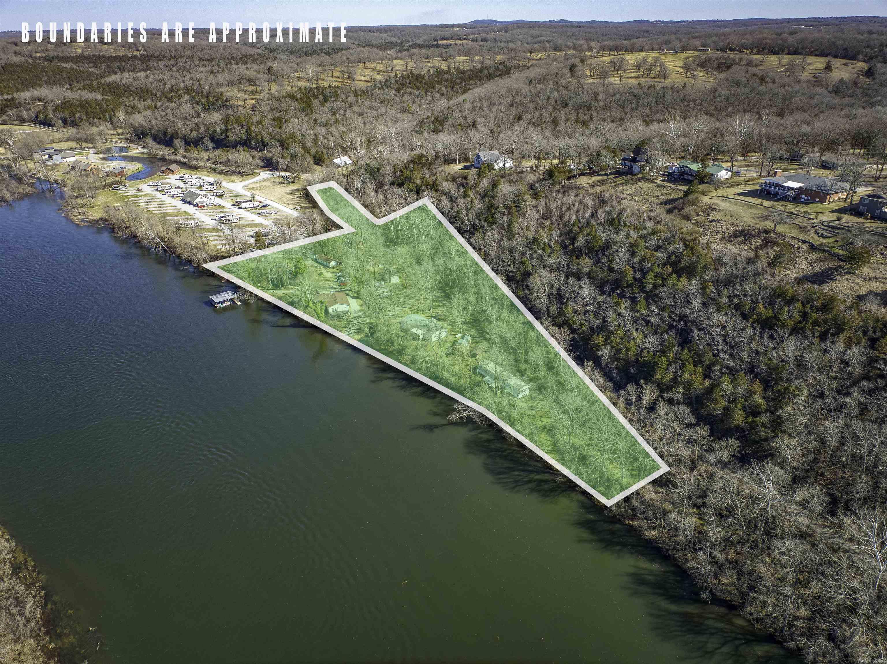 Here's an amazing 12-unit resort property that sits right on the banks of the famous White River. "His Place Resort" has had repeat clientele for the last 20 years for a reason! This 4.55-acre property has over 950 feet of river frontage, and is in a prime location known world-wide for its clear water and trophy trout! There are 12 units that are used as nightly rentals, a main house with an attached office, shop building with laundry and restrooms, 2 boat ramps, and a 6-bay boat dock. Ready for a change of pace in life? Wake up every day on the beautiful White River, and run your own  resort and guide service! Property has fiber optic internet