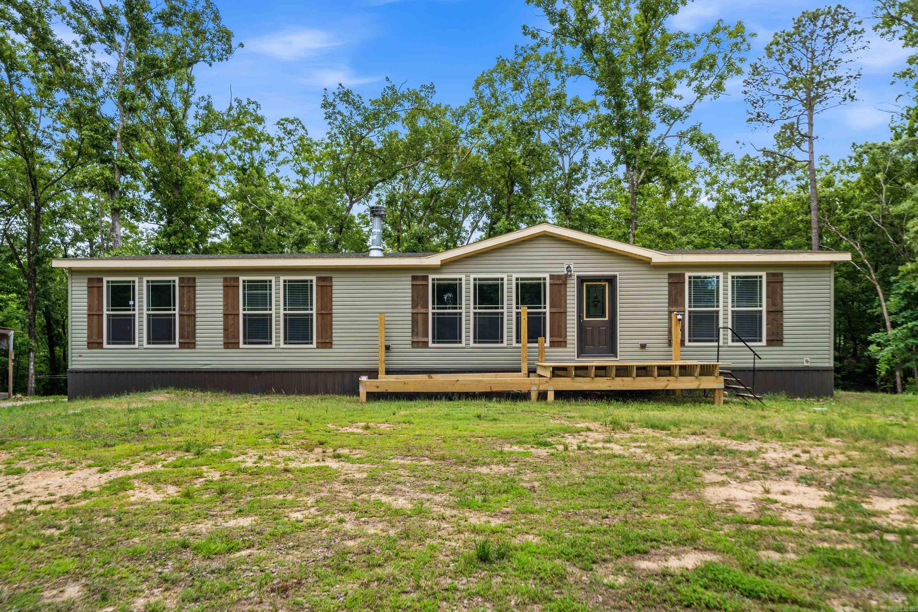 2024 modular home on 3.75 unrestricted acres in Pearcy, Arkansas! This beautiful property offers the perfect mix of modern comfort and country freedom. Featuring oversized bedrooms, walk-in closets, and an open concept layout between the kitchen and living area, this home was designed for both entertaining and everyday living. The primary suite is truly a showstopper with a spa-like bathroom you have to see in person. From the luxurious soaking space to the stunning finishes, this master bath is absolutely to die for. One of the best features of this property is the unrestricted land. Bring your animals, build a shop, park your RV or boat, start a garden, or simply enjoy the privacy and space that comes with owning acreage without the limitations of strict restrictions. Opportunities like this are hard to find! Located in the highly sought after Lake Hamilton School District, this property gives you the peaceful country setting while still being convenient to Hot Springs shopping, dining, and the lakes. Permanently tied down.