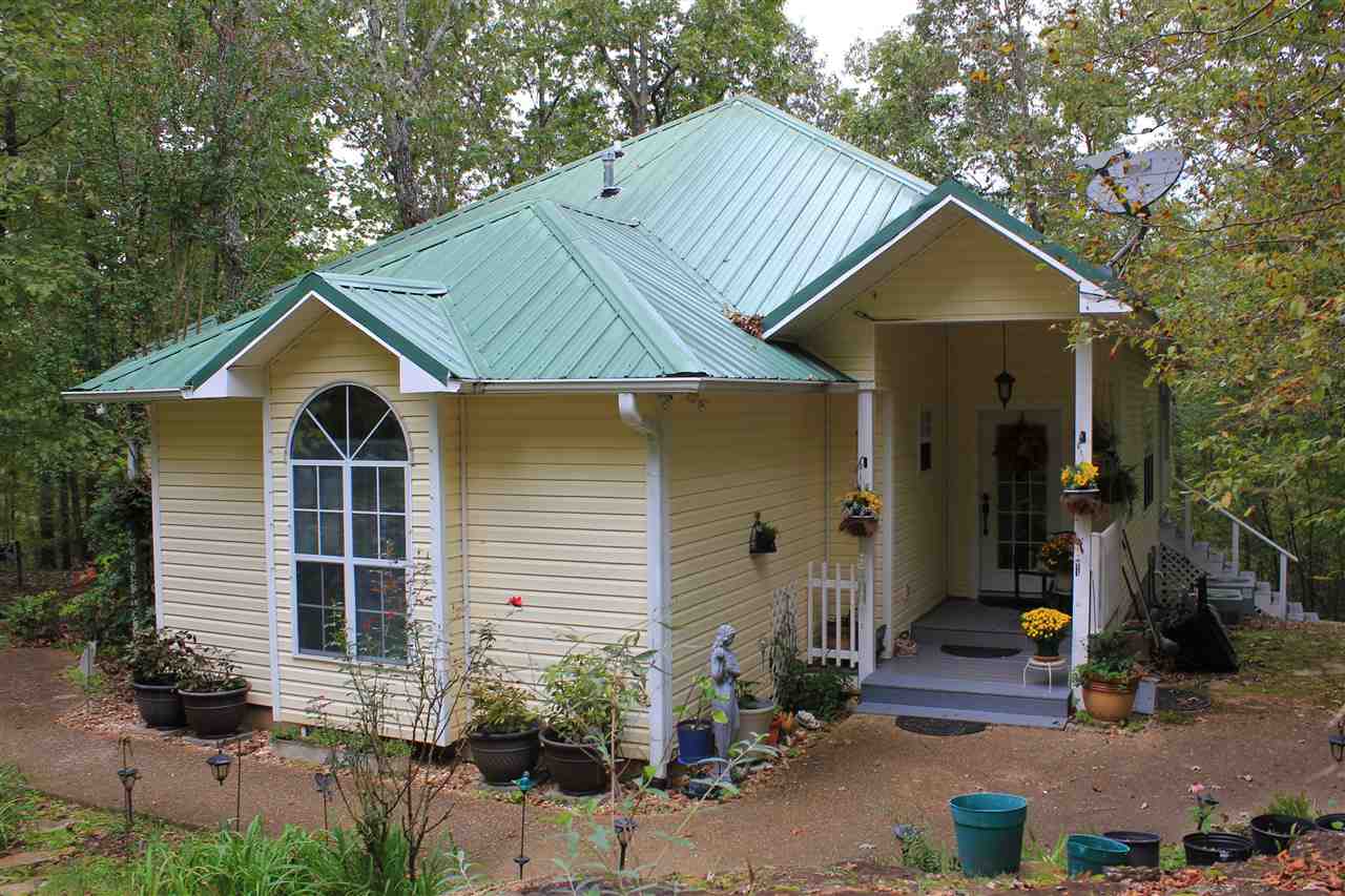 Beautiful 3 bed/2.5 bath home on 24 secluded acres. This well maintained home offers a living room with a gas fireplace, updated kitchen, open dining area, large master bedroom & bath with a walk in shower & jacuzzi tub, & much more. The upstairs features an open room that could be a 3rd bedroom or game room, but is currently being used as a craft room. Outside the home is a screened in back porch, workshop, generator, seasonal creek, & lots of wildlife. Located only 12 miles from downtown Mountain View.
