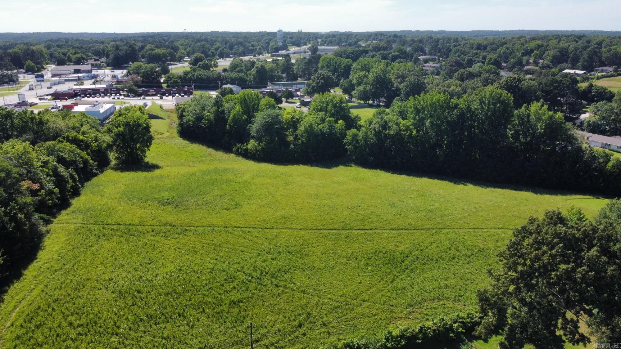 Beautiful Tract of Land, would be great to sub-divide for Single Family or Multi-Family Dwellings.  Located behind the Kum & Go that is at the corner of HWY 412 West and N. Rockingchair Rd.  It has  2 accesses off of N.  Rockingchair Rd, one off  Pleasant Meadow Dr and one off  Church Hill Dr. Presently zoned R-1. City Utilities available on three sides of property.