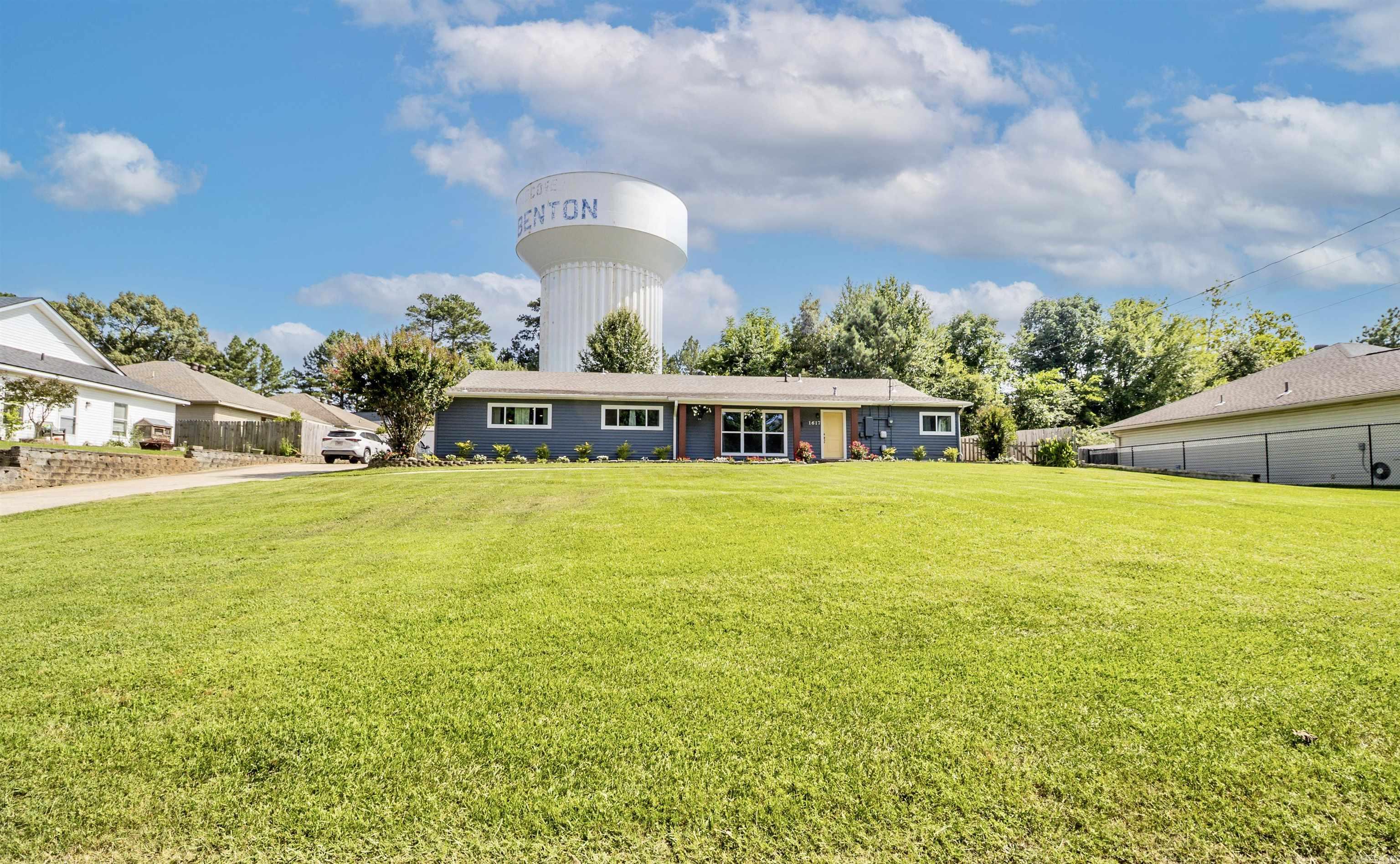 Beautifully updated and full of versatility, this 4-bedroom, 2-bath home sits on approximately 0.40 acres and includes an attached 1-bedroom, 1-bath apartment! The main home features an open-concept floor plan with updated finishes, white cabinetry, a spacious eat-in kitchen with breakfast bar, separate dining room, and a refrigerator that conveys with the property. The bright, open living spaces make entertaining and everyday living a breeze. Outside, you'll enjoy a large front yard with plenty of space to relax, play, or garden. A dedicated laundry room separates the main home from the attached apartment, providing added privacy. The apartment includes its own kitchen, living room, bedroom, full bathroom, large closet, and a private exterior entrance to the backyard. Perfect for multigenerational living, guests, or a home office, this unique property offers flexibility to fit a variety of lifestyles. Don't miss the opportunity to own this move-in-ready home with so many possibilities! Roof was replaced in 2023.