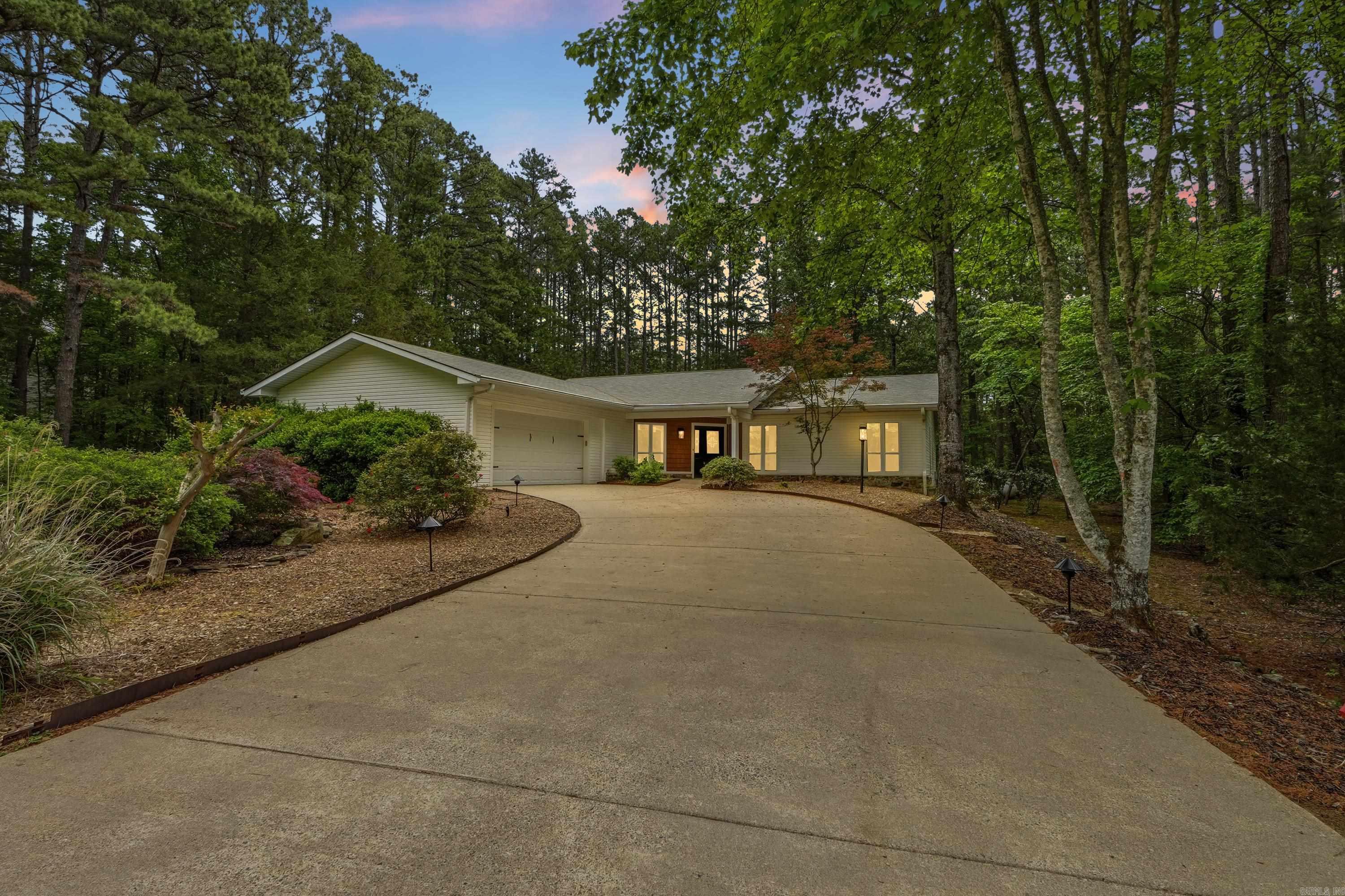 Great one-level home ideally surrounded by Mountain Ranch golf course on a quiet, peaceful street. This beautifully maintained property features new windows, newer flooring throughout, and stunning quartz countertops in the kitchen, primary bath, and laundry area. The spacious primary suite offers a large walk-in shower and elegant coffered ceilings, also featured in the living and dining areas. Enjoy year-round comfort in the enclosed heated and cooled sunroom overlooking the beautifully landscaped backyard, or unwind on the deck with cable railing—perfect for relaxing or entertaining. The home includes a large garage with extra storage, a generous walk-in pantry, and a well-designed laundry space with abundant storage throughout. Cozy evenings await by the stone fireplace with gas logs and blowers. Located just 5 minutes from Mountain Ranch Clubhouse and 10 minutes to Greers Ferry Lake, this home also gives you access to the incredible Fairfield Bay lifestyle—featuring 3 swimming pools, scenic hiking and biking trails, ATV trails, pickleball courts, tennis, bowling, miniature golf, and two 18-hole golf courses. Virtually staged. See agent remarks.