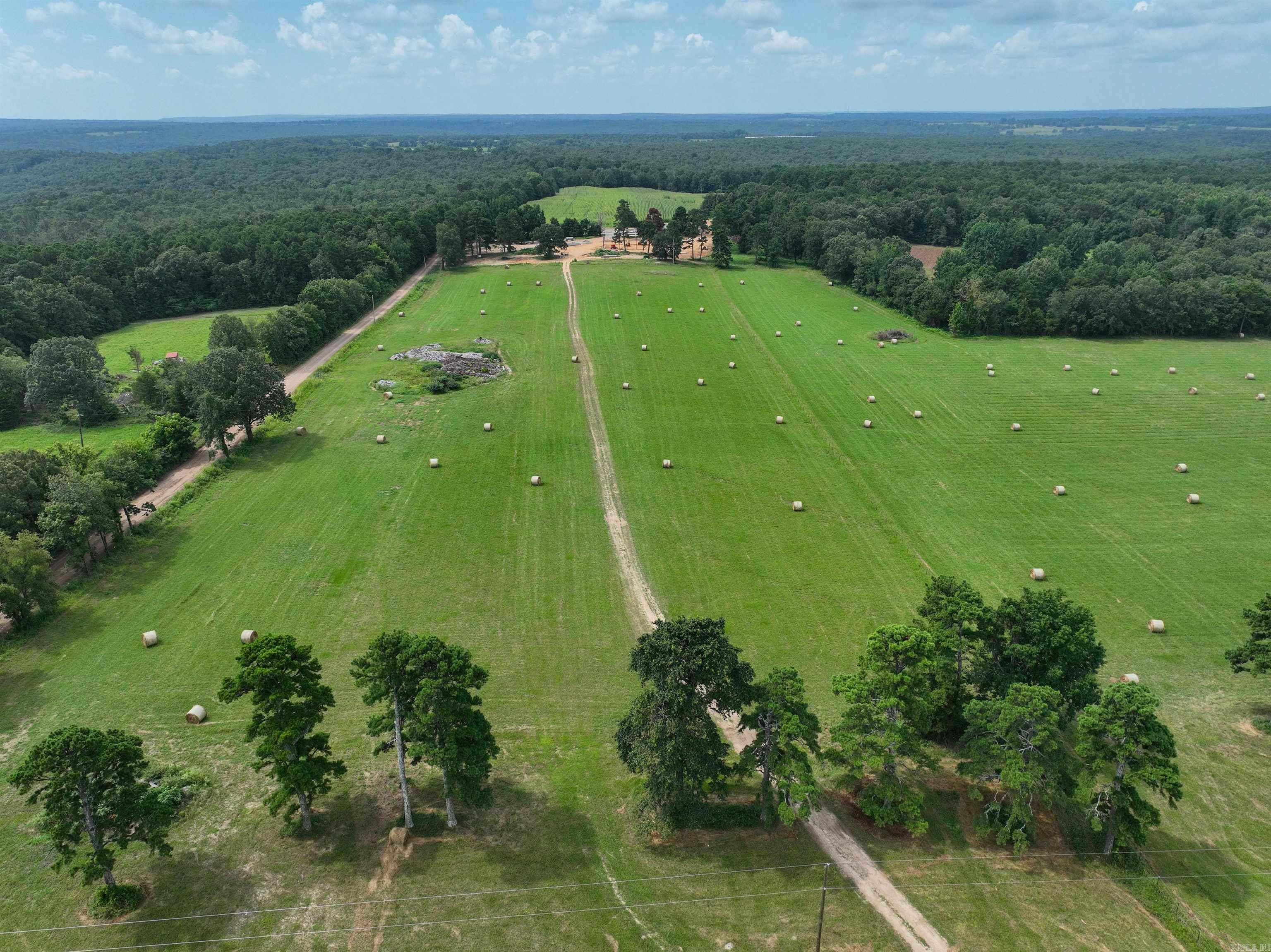 Escape to the peace and beauty of the countryside with this georgeous 158-acre farm-featuring a beuitful, new-custom 2,900 sq ft home designed for comfort and moderen living. If you've been dreaming of wide-open spaces, fresh air, and room to roam, this beautiful farm has it all!  Home Features:  * Spacious open-concept living room, kitchen, and dining area-perfect for family gatherings and entertaining *Versatile bonus room ideal for game room  or office *Safe room for peace of mind *3 bedrooms *2 1/2 bathrooms with high end finishes  Property Highlights:  *Commidity barn and shop-ideal for feed, equipment storage, and mechanicing *Underground springs flow througout the property, keeping the ground lush *Irrigation has possiblities here as well *5 ponds *158 acres of Rolling pastures for cattle, horses, and crops *It has a proven crop hisotry *over20 acres of ideal hunting property *fence line bunks, automatic water tanks, rational grazing/cattle pens   From sunrise over the pastures, to enjoying the porch at sunset, every moment here feels like a retreat! Wheather you are looking for a working farm or private getaway, this property delivers an unparalleled opportunity.