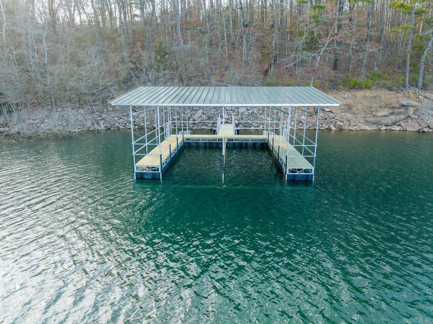 This 3.25-acre lakefront lot in the new Vida Del Lago subdivision offers privacy, luxury, and is zoned for a 2-slip boat dock in a sheltered cove. With a gated entry, paved road, and 3+ acre lots, it’s a perfect spot for your dream home. The east-facing backyard provides afternoon shade, and the location next to Twin Coves in Greers Ferry offers a peaceful setting. A 2,000 sq. ft. minimum home size ensures quality, and power will be available once construction begins. POA assessments and taxes are still to be determined.