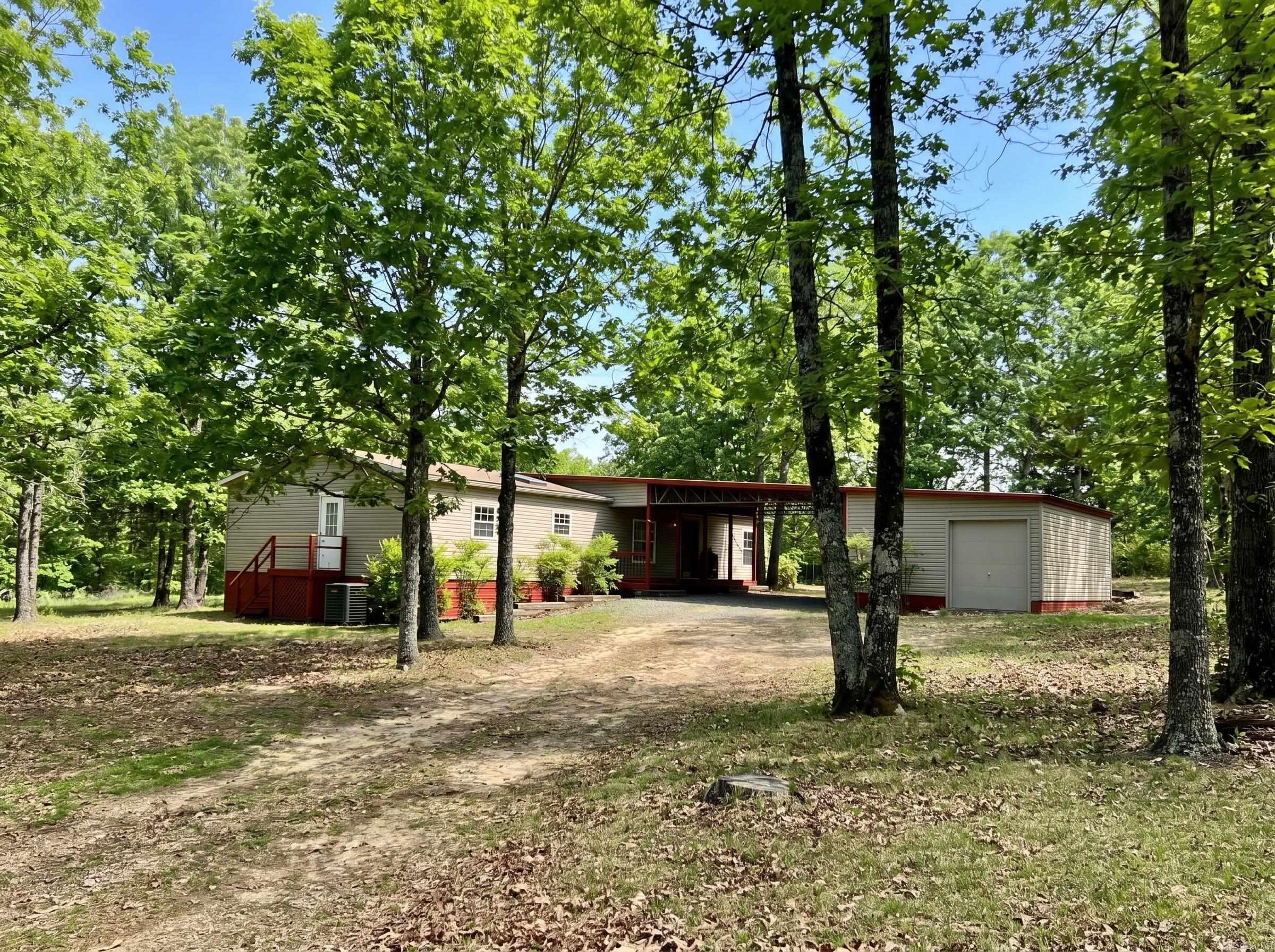 Nestled on 4 beautiful acres, this refreshed 3 bed, 2 bath mobile home offers comfort, charm, and room to roam. The home features a spacious refreshed kitchen with a butcherblock topped island and re-surfaced countertops as well as upgraded appliances, a cozy fireplace, and a mudroom/pantry for added convenience. A brand new HVAC has been installed as well as new carpet and fresh paint throughout for added comfort and ease. All outlets have been upgraded throughout the home as well. An attached workshop with full electric provides excellent space for projects or storage. Outside, you'll find a partially covered back deck perfect for enjoying the peaceful scenery. Dreaming of a hobby farm? This is what you've been looking for! Recent survey already on file. Please Note..some rooms are virtually staged.