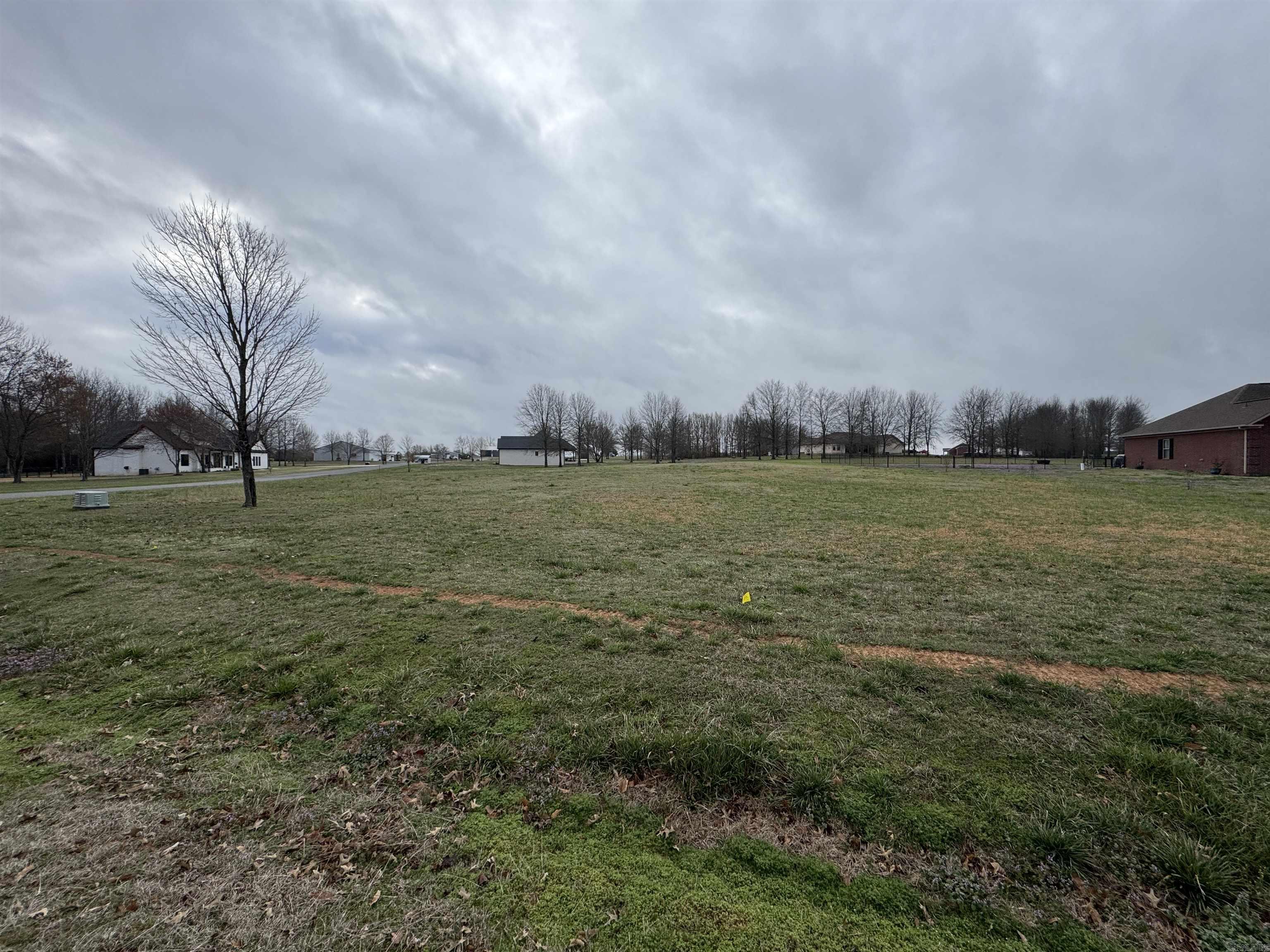 Want to live on one of the best private lakes in Arkansas? Then this is the place for you! This spacious corner lot would be ideal for your dream house. This subdivision is a peaceful neighborhood built on the beautiful Win Meadow Lake. This 55 acre lake offers excellent fishing opportunities and is fully stocked with trophy Largemouth Bass & Crappie. Enjoyment of the lake is limited to residents of the subdivision and their guests. There is a well-maintained boat launch and fishing access available to residents of the lake. Homes built here are subject to a few covenants to maintain a beauty and quality of living found few other places. Come check out this beautiful neighborhood today! Only a limited number of lots are left available to the public so don't expect these to last long.