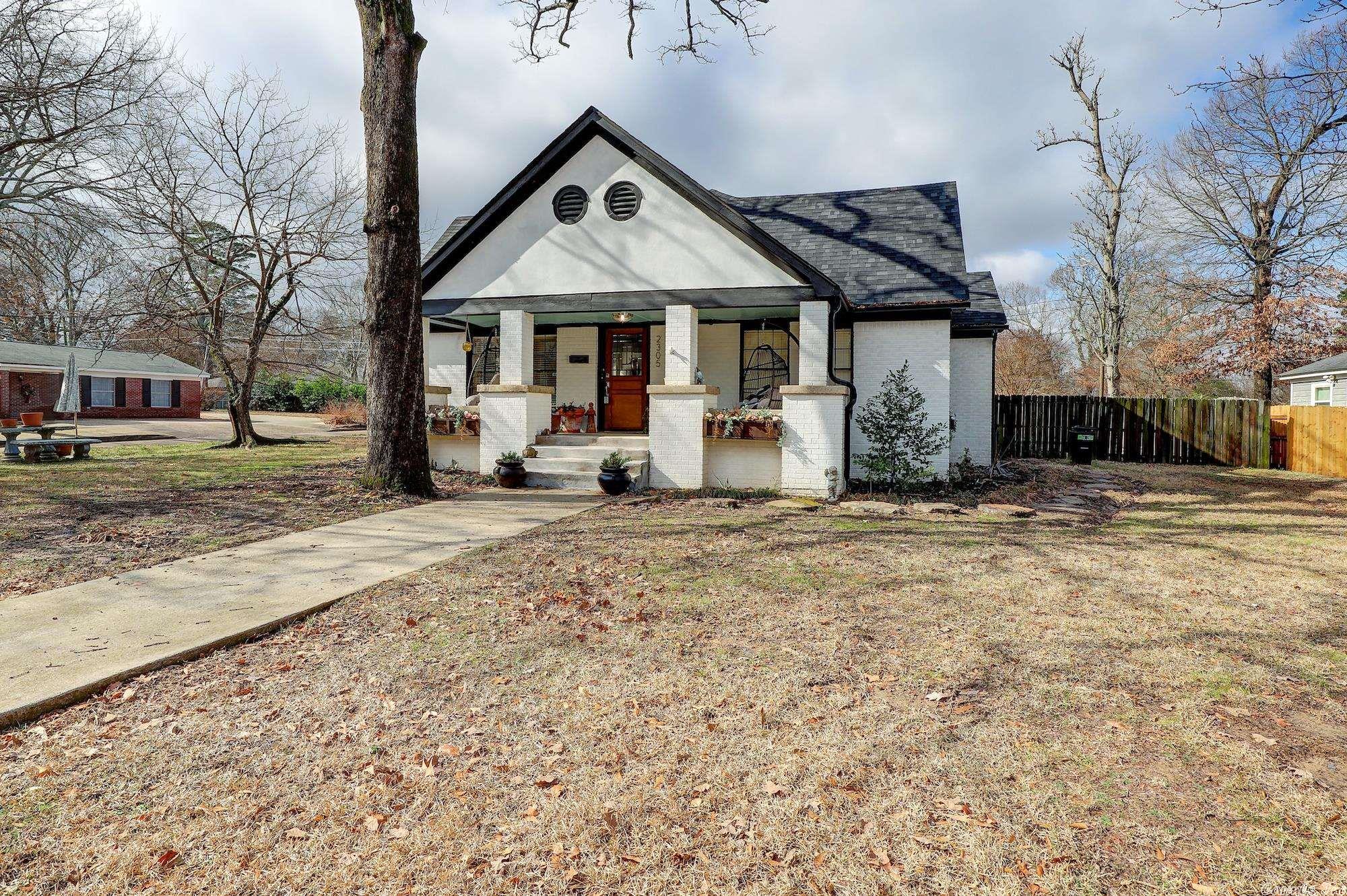 Welcome to your new home!  Located in the best area of Texarkana Arkansas on the brick portion of Beech Street surrounded by delightful historic homes.  This beauty has been completely updated and upgraded from top to bottom--with upgrades to electrical, plumbing, HVAC, appliances, etc.  You will delight in the two large living areas, oversized kitchen with eat-in dining and desk area.  4 beautiful bedrooms, 2 full bath & darling upstairs office.  Privacy fenced with covered outdoor entertaining space. You must see this charming and inviting home!