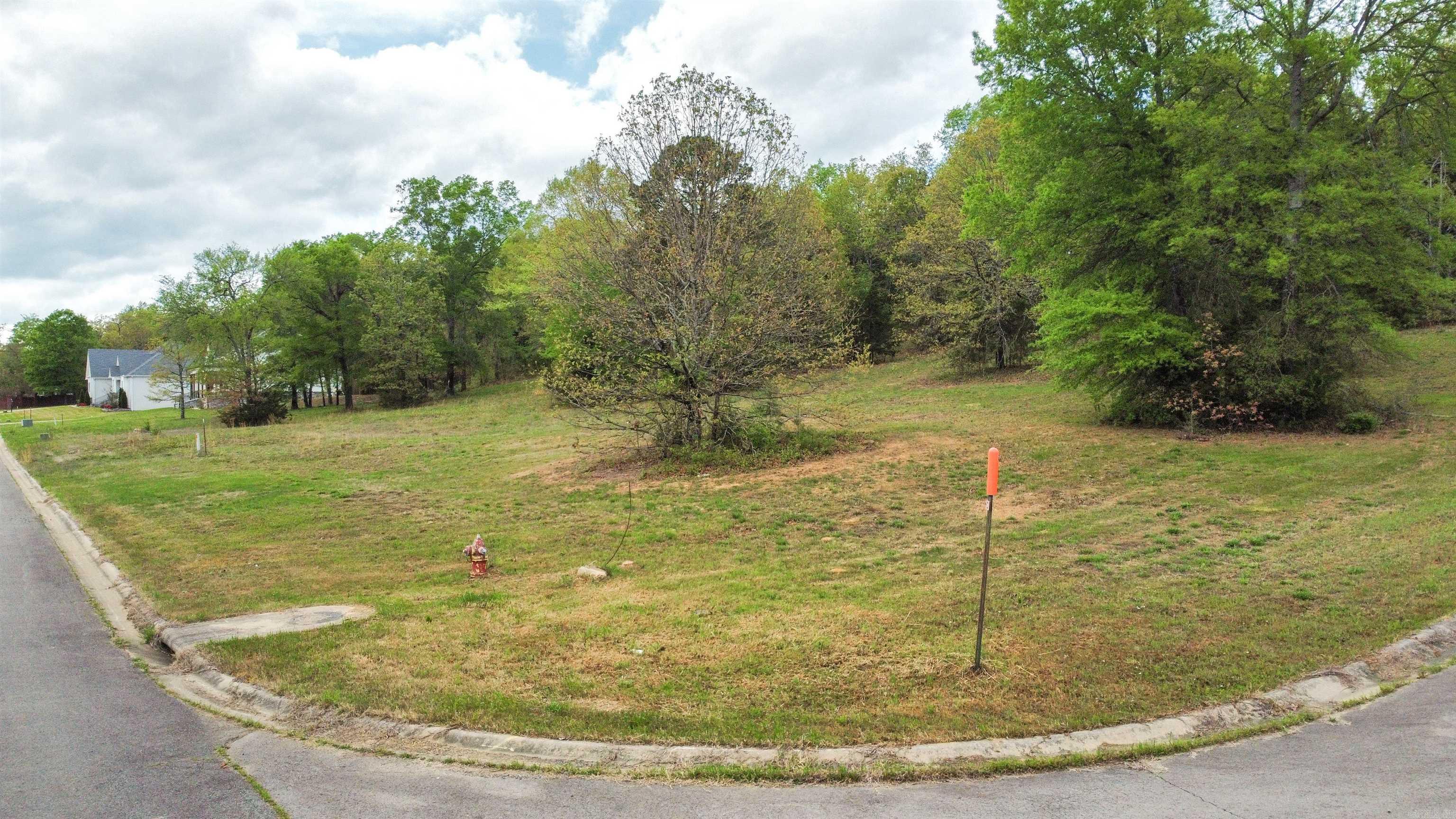 1.7 Acre Corner Lot in a Gated Subdivision Don’t miss this rare opportunity to own a 1.7-acre corner lot in a desirable gated subdivision. This level, build-ready property offers an ideal setting for your future home with plenty of space for outdoor living, additional structures, or simply enjoying the surroundings. Comprised of two lots, this property provides added flexibility and spacing compared to typical homesites. The extra land offers a sense of openness and room to grow, making it a standout option in the area. If you’ve been looking for a larger homesite in a well-maintained community, this property is ready for your vision.