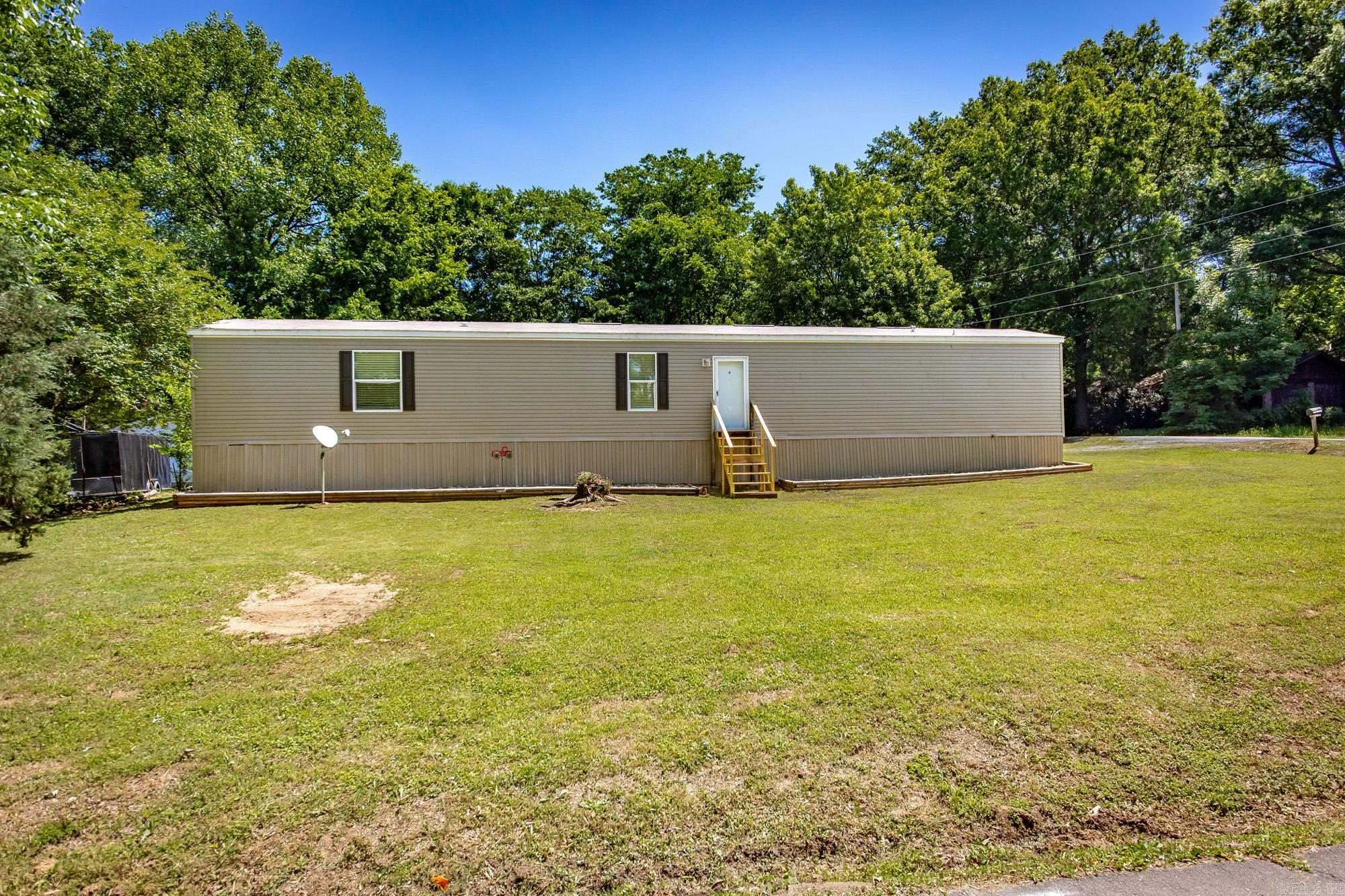 Enjoy lake living without the waterfront price! This 3-bedroom, 2-bath home offers 1,136 sq ft of comfortable living space on a permanent foundation, perfectly positioned just across from Lake Conway. Whether you’re looking for a full-time residence, weekend getaway, or investment opportunity, this location delivers.  Be part of Lake Conway’s exciting 5-year transformation currently underway—making now the perfect time to buy and benefit from the lake’s future improvements, including enhanced boating access, upgraded infrastructure, and improved recreation.  Inside, you’ll find a functional layout with great potential, while outside offers a storage building for added convenience. The property also provides quick and easy access to the interstate, making commuting to Conway or Little Rock a breeze.  Opportunities like this don’t come around often—secure your spot near one of Central Arkansas’ most popular lakes while it’s on the rise. Schedule your showing today!