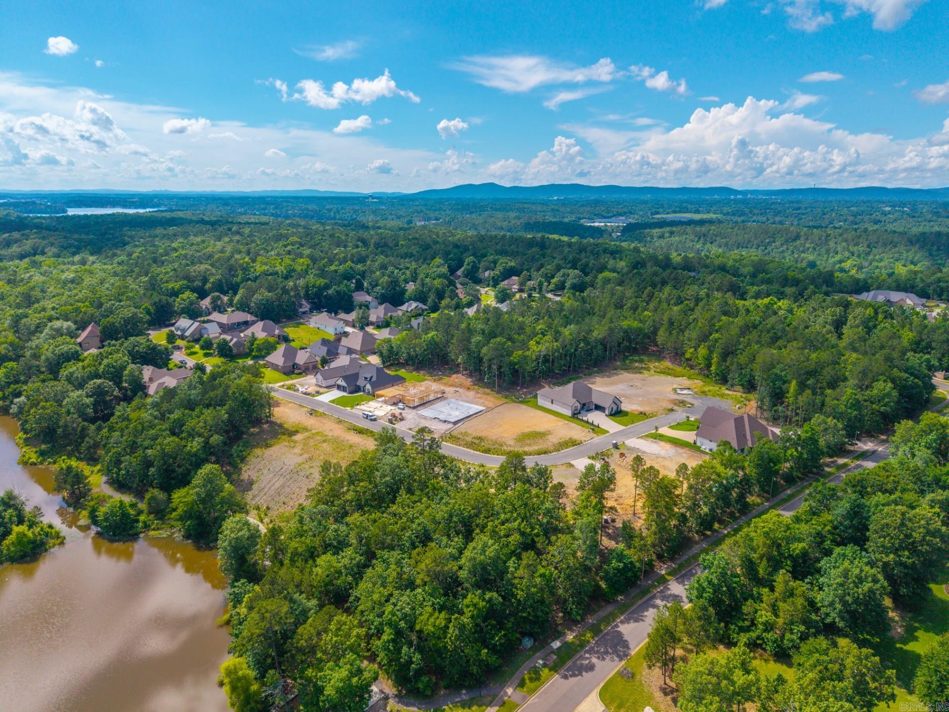 New lots available in Hot Springs’ premier gated community, Red Oak Ridge. Garden’s Gate Phase 2 is complete and there are still a few lots to choose from including this lake lot.   Residents enjoy two private stocked fishing lakes, wooded walking trails and scenic paths, all surrounded by natural beauty and stunning views. Additional amenities include a pool facility plus easy access to downtown Hot Springs, Garvan Woodland Gardens, Oaklawn, the Hot Springs Country Club and more. See documents for recorded plat.