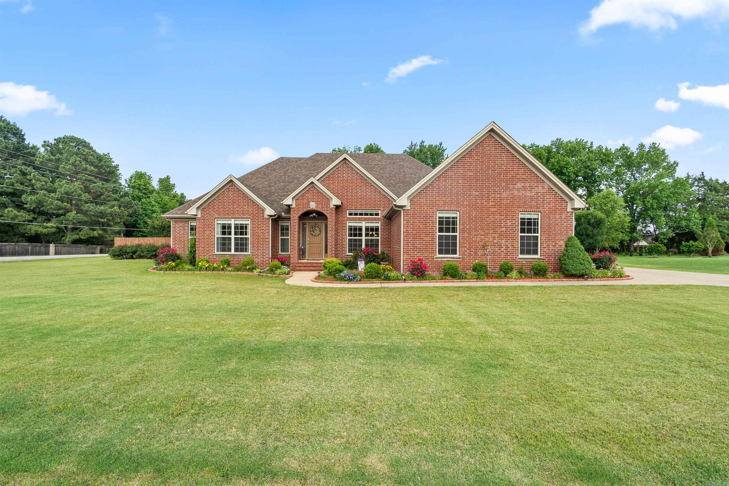 RARE find in Searcy, Arkansas with a 26x34 detached shop! This 4 bed, 2 bath home offers 2,531 sqft PLUS a massive 26x34 detached shop with its own separate driveway entrance, garage access, 60 AMP circuit, and additional 11x34 attic storage area. Sitting on a HUGE landscaped lot filled with mature blooming crepe myrtle trees, this property gives you the kind of extra space most buyers struggle to find. Major updates already completed including NEW roof (2024), NEW HVAC (2024), and NEW water heater (2024). Whether you need space for hobbies, vehicles, a workshop, storage, or entertaining — this property delivers both inside and out!! Property includes an IRRIGATION SYSTEM already installed (needs a new pump).