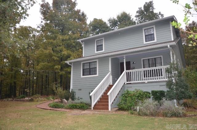 Cute! Cute! Cute!  Looking to get away or stay away...don't miss this one.  Cottage type house nestled on tree laden hill top with country porch and plenty of nature.  Hardwood floors in dining room, remodeled baths and fresh exterior paint.   HVAC replaced 2010 and Bosch dishwasher installed 2009.  PLUS 12x16 metal storage unit.  Great place to escape the hustle and bustle.