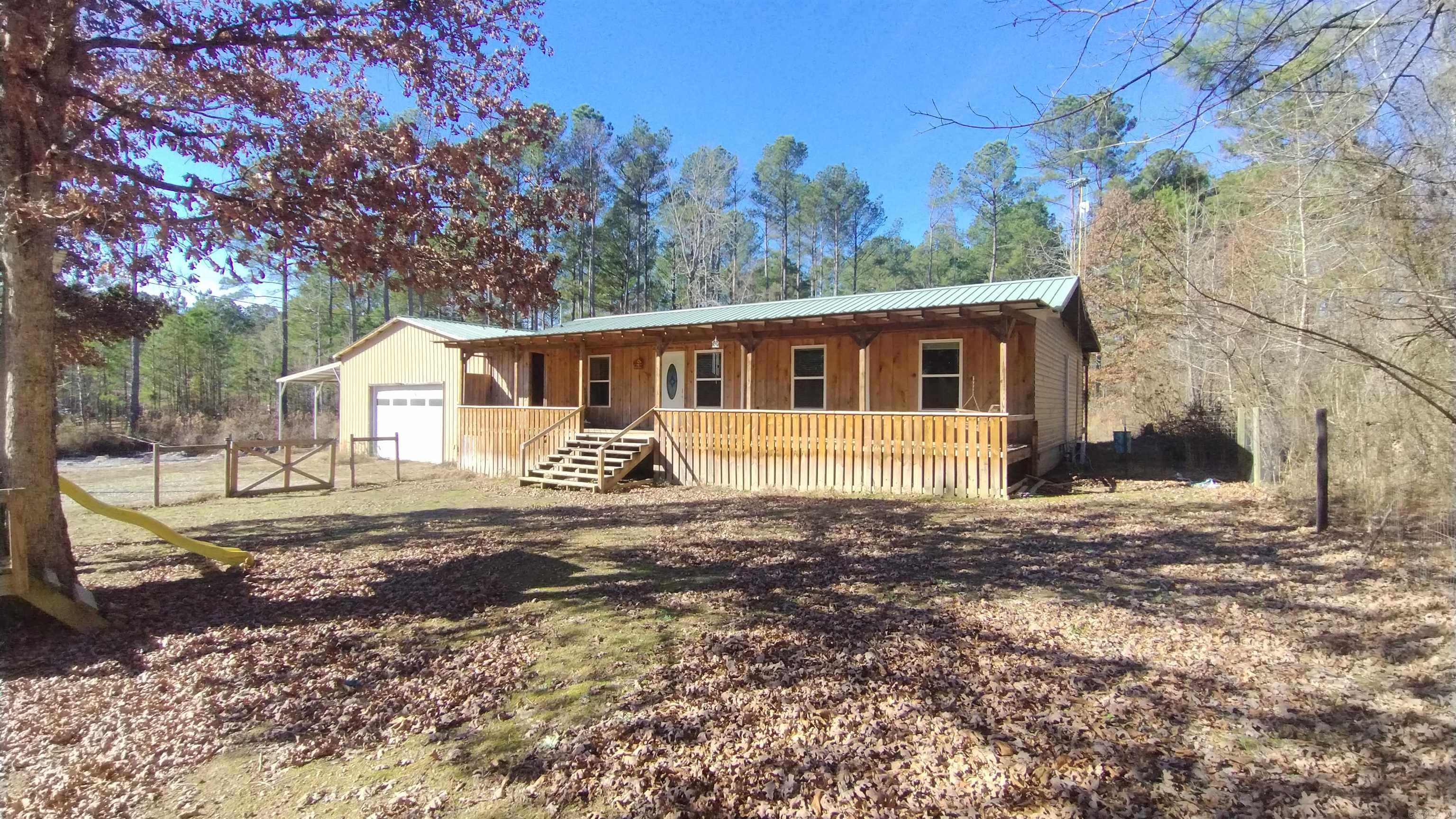 GREAT OPPORTUNITY! Step into the perfect blend of space, comfort, and convenience with this beautiful four-bedroom, three-bath home set on a peaceful, non-busy road just minutes from town. Enjoy relaxing mornings and evenings on both the covered front and back porches, while the fully fenced front yard adds charm and security. The detached garage with a loft offers endless possibilities—storage, a workshop, or a creative retreat. With this amount of land, you’ll have plenty of room to roam, garden, or simply enjoy the quiet, all while staying close to shops, schools, and everyday necessities. DON'T MISS OUT. This is not a mobile home.