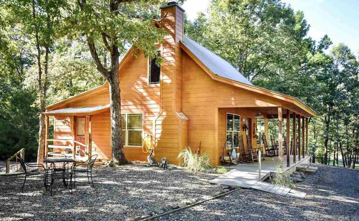 Nothing like THIS on the market! Fantastic Cabin on 10 acres bordering National Forest, close to Wolf Pen Gap & Trails! Open Floor plan Cabin has bedroom & bath downstairs & loft bedroom w/ 1/2 bath up! Custom cabinets! There are 3 RV hook up all w/ water, electric & septic! The Toy Hauler Camper stays w/ property & is clean & nice! Outdoor kitchen/entertaining building w/ full bath could easily be made into another cabin! 2 small ponds & shop! Some Furnishings included! Perfect for family a get away!