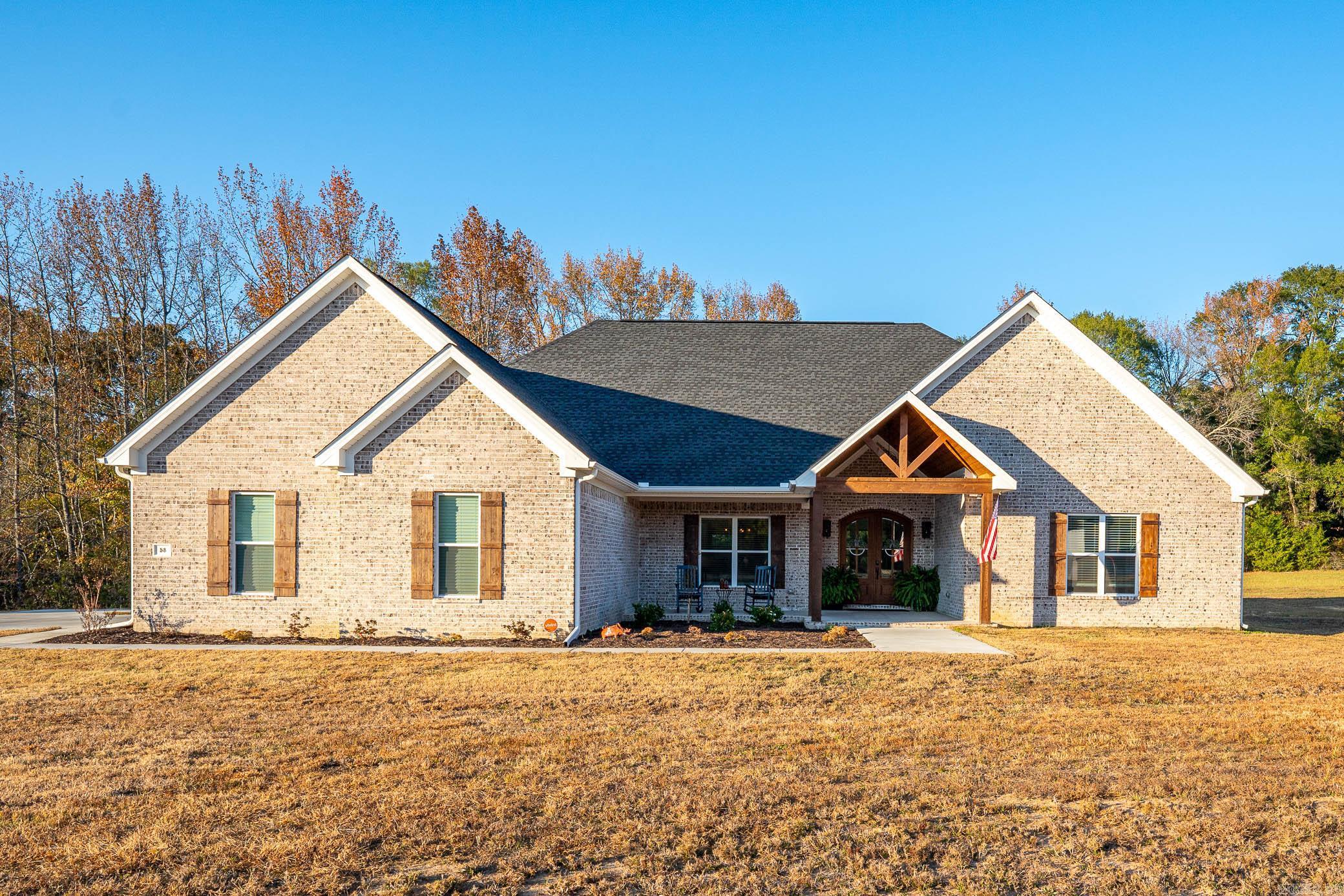 Beautiful, spacious 4 bed/3 bath home in Greenbrier on a one acre lot built in 2022! Wonderful covered front porch with stained wood ceiling. Open floor plan with large living room, dining room, and kitchen. Living room features a gas fireplace with tons of natural light. Kitchen is a chef’s dream with gas stove, custom cabinets, granite countertops, black stainless steel appliances, and a huge center island with storage on both sides. There is a separate walk-in oversized pantry. Large primary bedroom suite with tons of storage, built-ins, large walk-in closet, separate sinks/vanities with granite countertops, beautiful, walk-in tiled shower, and wonderful soaker tub. Access to the laundry room from the primary bath or mudroom/garage entry area. One guest room has an en suite bath and the other two guest rooms share a nice sized hall bath. New blinds. Home security system, e-thermostat and luxury vinyl flooring throughout. The spacious backyard has a great covered patio with a stained wood ceiling and attached deck. Beautiful front landscaping.