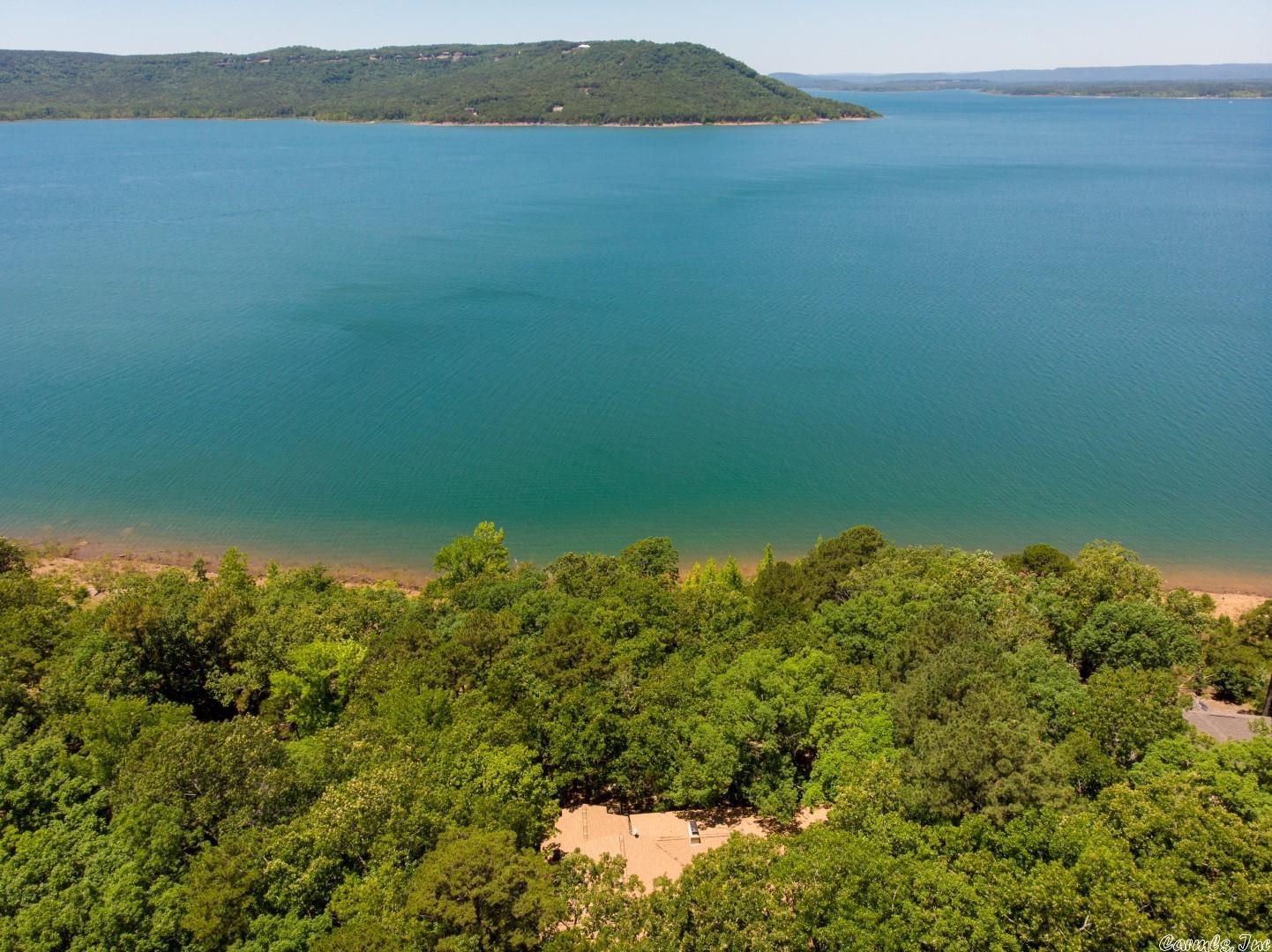 Eden Isle LAKEFRONT home!!! 5-bedrooms, 4-full baths, 3-living areas, 3-fireplaces, fantastic lake views with beautiful sunsets and easy lake access, great rustic Eden Isle feel, most of the home is on the main level...just one living area and one bed/bath downstairs. Granite tops, LOTS of glass, great covered deck, wet bar, 2-car garage and much more!  A wonderful home for a large family or two families!  ***Final sale price did not include personal property...PP was paid for outside of closing!