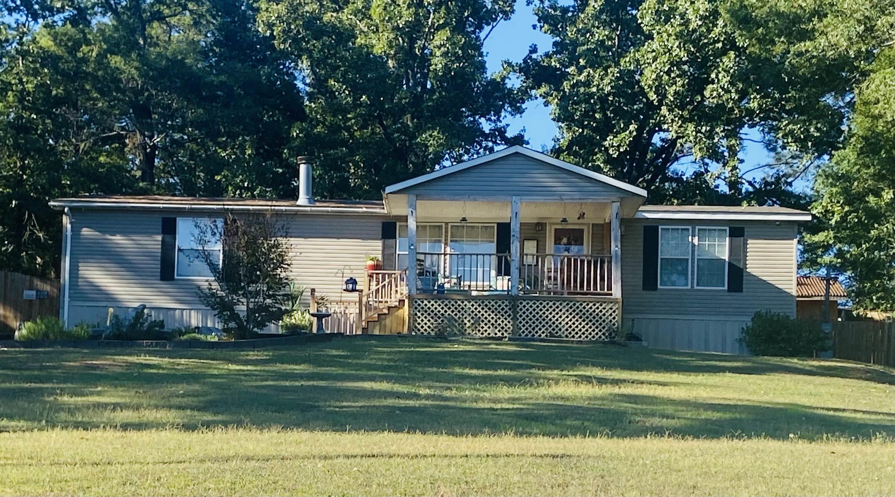 Take at LOOK!  This adorable 3 bedroom, 2 bath home has plenty of indoor and outdoor living and entertaining space for the whole family! It includes a workshop, large deck and a roomy front porch.  Give me a call today!  This one won't last long!
