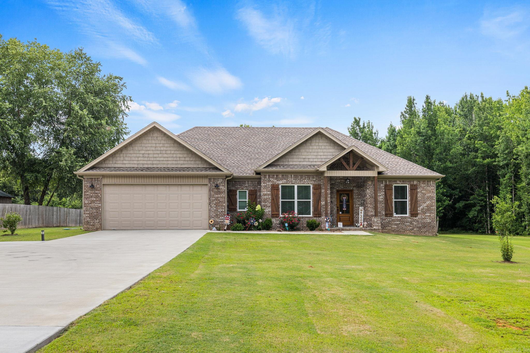 Welcome HOME to this beautifully built home nestled on 1.39 peaceful acres. Offering Comfort and Country Charm. Enjoy an open and inviting floorplan designed for everyday living and effortless entertaining. The spacious kitchen is the heart of the home, featuring a large center island, abundant cabinetry and a walk in pantry that provides exceptional storage and organization. The thoughtfully designed split bedroom floor plan offers privacy for the primary suite, where you will find a luxurious retreat complete with a soaking tub, oversized walk in shower and generous closet space. Step outside to relax on the covered back porch, perfect for enjoying quiet mornings or entertaining guests while taking in the beauty of nature. An extra parking pad provides added convenience for guest and your outdoor toys. Located in the highly sought after Cabot School District this exceptional home offers the best of both worlds peaceful out of town living with the convenience of an easy commute to nearby shopping, dining and amenities.