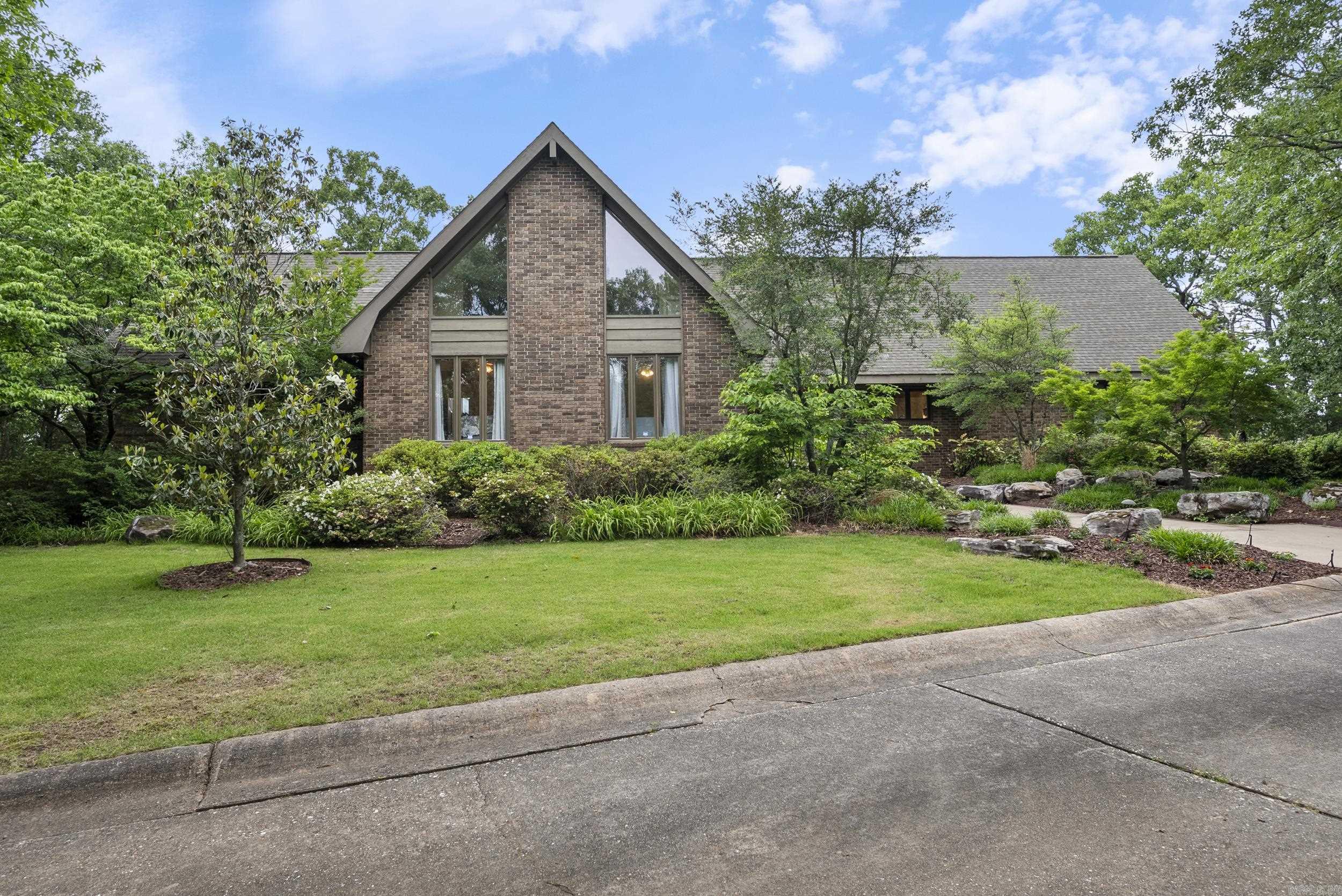 ENTERTAINERS DREAM HOME! Welcome to this beautiful home with stunning views overlooking Conway on approx. 2.51 private, wooded acres. As you make your way up the drive, you will be amazed by this three-level home that features 5 bds, 4.5 ba, open kitchen, formal dining, 3 living spaces, Office & flex rooms, 2 garages, outdoor kitchen & dining, AMAZING views from the multi level deck w/sunken hottub, water feature, extra landscaping, & sprinkler systm. Pella roll-screen windows,solid wood doors,custom birch paneling, antique brick floor downstairs. RECENT UPDATES include: Downstairs NEW PAINT, FLOORING, & LIGHTING & downstairs bathroom remodeled. A focal pt in the main grt rm is a rock & flagstone fireplace extending to the top of the 2story vaulted ceiling. Upstairs you will find the theatre rm w/extensive hidden storage and exercise area, living space, and office. Downstairs has 2 bedrooms w/ 2 full baths, living area w/ antique brick floor, game area for your gaming tables & bar area. Could also be used as a mother in law quarters, H/C Workroom off the ds garage. H/C 27x20 mancave w/storage.  AGENT SEE REMARKS! This home is a MUST SEE!