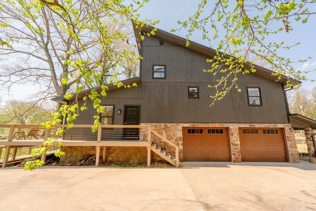 RIVERFRONT home on the LITTLE RED RIVER with its own private dock, completely renovated! This 1,920 sq ft, 3 bedroom, 2 bath split-level home features a side-entry oversized 2-car garage and offers the perfect setup for full-time living or a successful Airbnb. Recent updates include a brand new deck and dock with boat slip, new garage doors, fresh interior & exterior paint, landscaping and a new metal roof to be installed. The home features a beautiful new wood ceiling in the living room, remodeled bathrooms, all new appliances, new quartz countertops and new LVP flooring and window blinds throughout. Enjoy peaceful river views and move-in ready convenience in this thoughtfully updated property. Convenient to multiple Little Red River boat launch areas and walk-in access. Greers Ferry Lake is a short 20 minute drive. Contact your agent for a showing today!