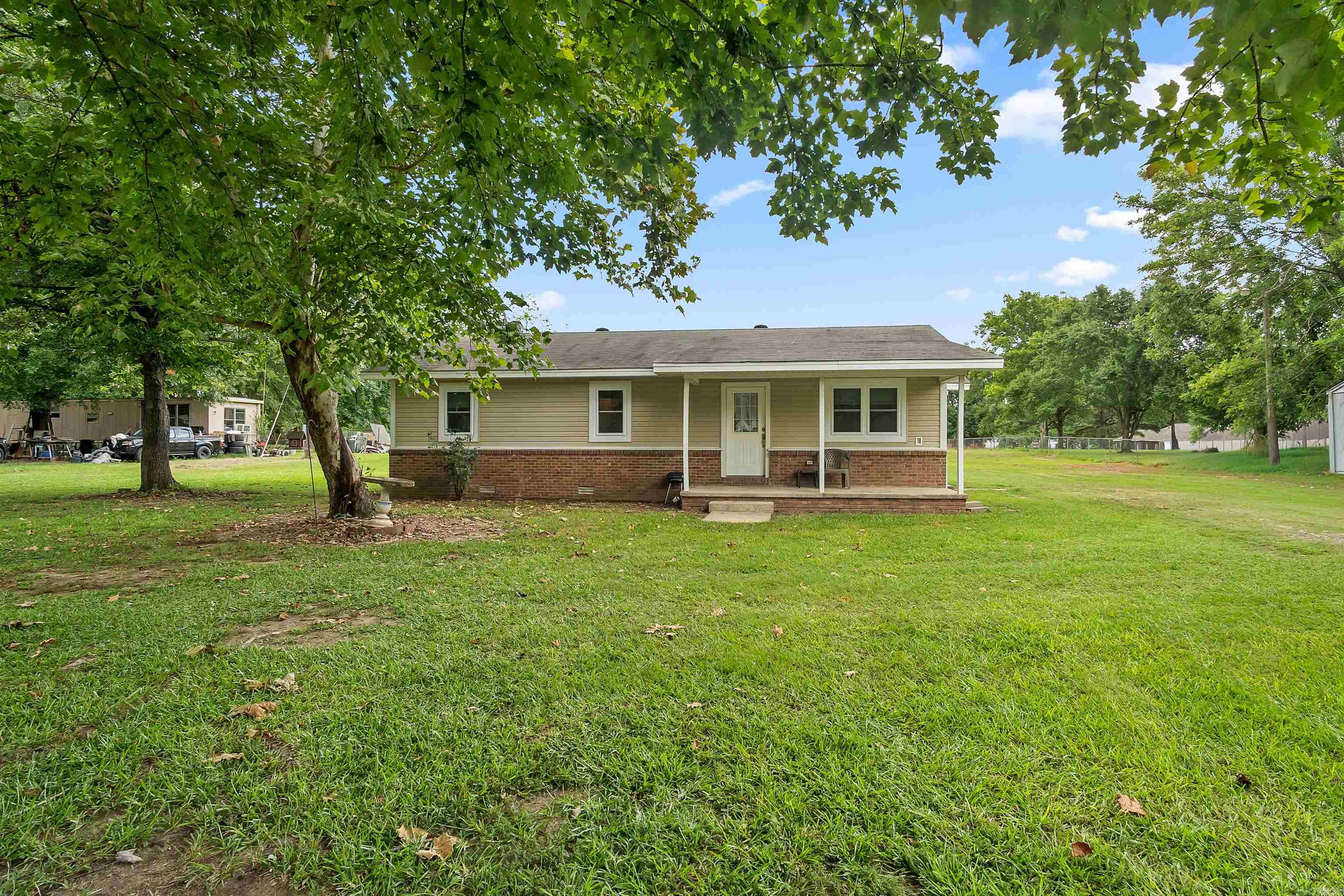 Welcome to 175 Charlie Loop Road! This charming 2-bedroom, 1-bath home offers approximately 1,176 square feet and sits on just under an acre. Inside, you’ll find generously sized bedrooms, a cozy living room, and a separate kitchen and dining area. The spacious primary closet wraps around and provides convenient access to the bathroom. The HVAC system, water heater, and roof were all replaced in 2014. Enjoy peaceful country living with plenty of outdoor space to make your own!
