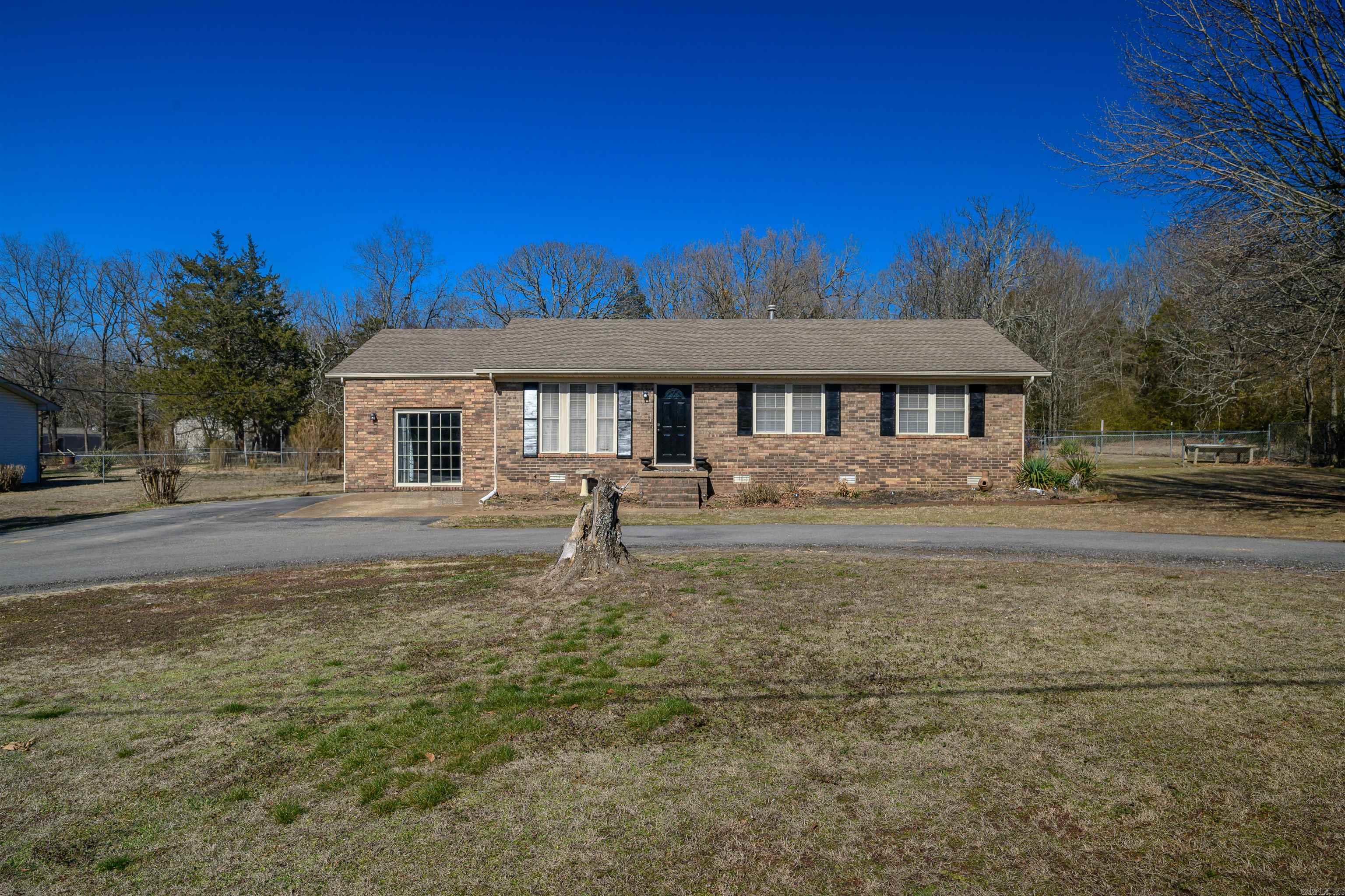 Very well-maintained 3-bedroom, 2-bath brick home located in the desirable Southside area on a quiet dead-end street. The home features a living room with a gas fireplace, a nicely appointed kitchen, and a bright sunroom. The spacious primary bedroom offers plenty of room to relax and unwind. Exterior amenities include multiple decks, attractive landscaping, a storage building, and a detached garage with an attached dog kennel. The fenced backyard provides a great space for pets, play, or outdoor entertaining. Conveniently located just minutes from Southside Schools and local shopping. Roof was replaced in 2018. Home is currently on septic; seller states city sewer is planned for installation (buyer to verify). Schedule your showing today.
