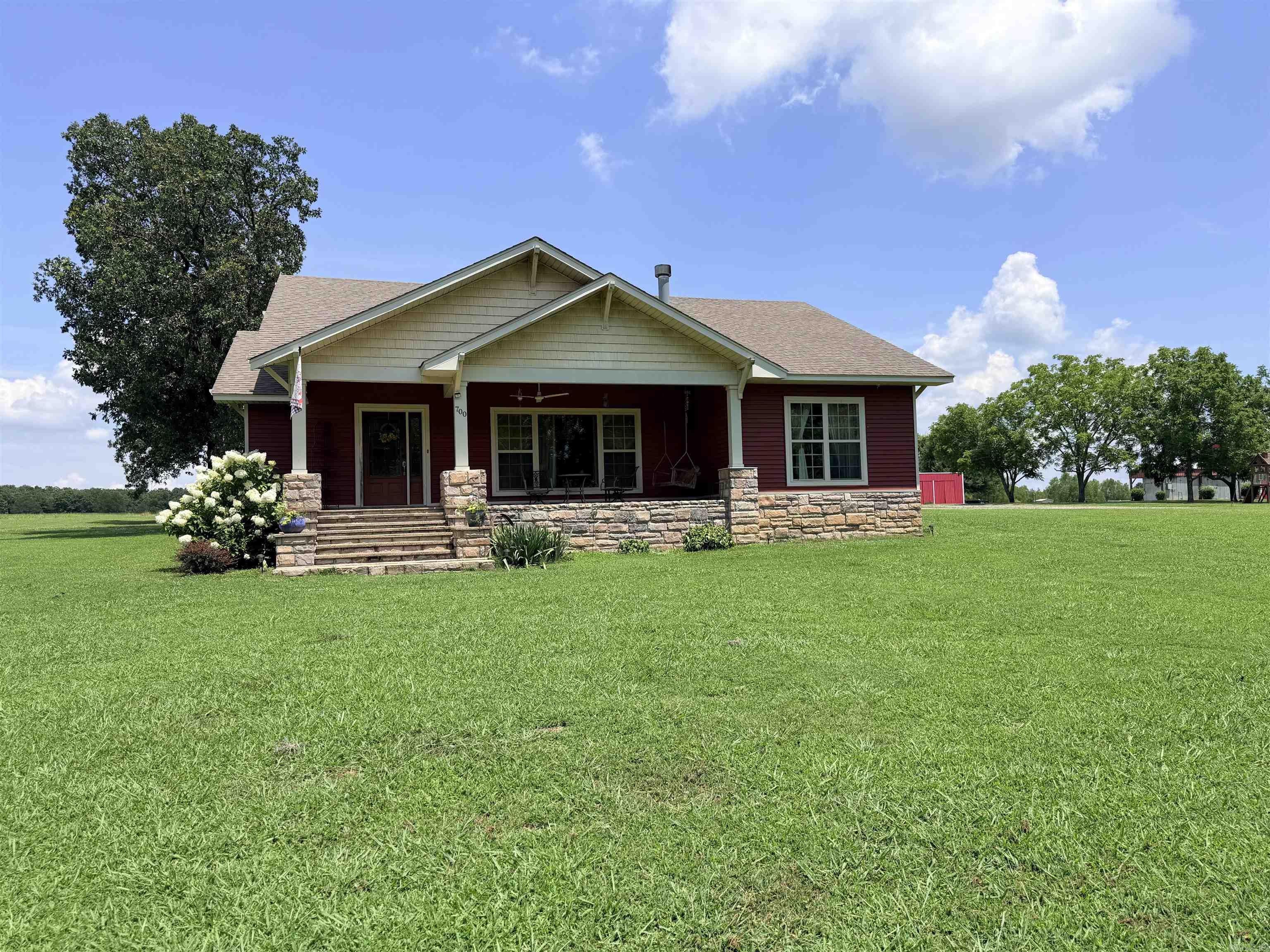 Experience peaceful country living in this charming home nestled on 1.36 picturesque acres. Designed with comfort in mind, this inviting property features neutral colors throughout, creating a warm atmosphere. The spacious kitchen is perfect for everyday living offering a breakfast bar, stainless steel appliances, abundant built-ins and plenty of workspace. Luxury vinyl plank and tile floors add durability to the home. The generous primary suite provides a relaxing separate tub and walk-in shower. A cozy gas log fireplace in the living area, while the welcoming foyer makes a great first impression. The flexible floor plan includes two bedrooms plus a large office that could easily serve as a third bedroom. A spacious laundry room with a utility sink adds everyday convenience. Additional features includes a whole-home generator and home vacuum system. Step outside and enjoy the beauty of plenty of room for gardening, recreation or simply relaxing. If your looking for the perfect blend of country charm and functional living space this property is ready to welcome you home. Call for your personal tour today. SEE AGENT REMARKS!