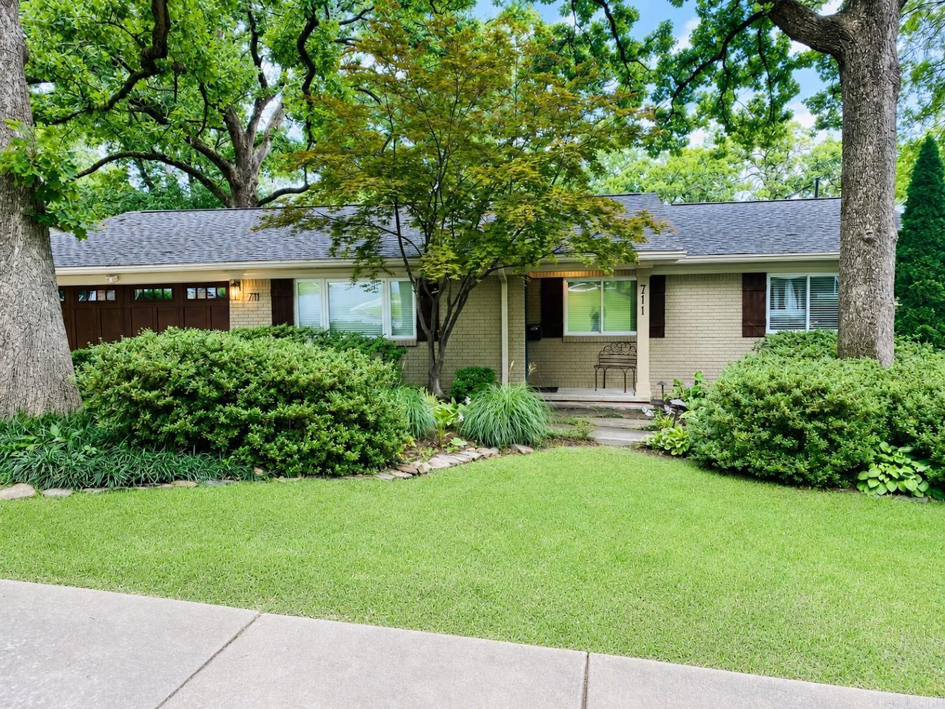 Beautiful home in Midtown area. Excellent condition. Kitchen updated in November 2025. New roof installed in 5/26. Professionally landscaped yard with great curb appeal. Irrigation system. Primary bedroom with a large walk-in closet and ensuite bathroom. 4 bedrooms on the main floor. The 5th bedroom is downstairs with a separate living room, bathroom, and laundry room. Two-level composite wood deck and attached screened in wood porch with tongue and groove ceiling. Great street and neighborhood!
