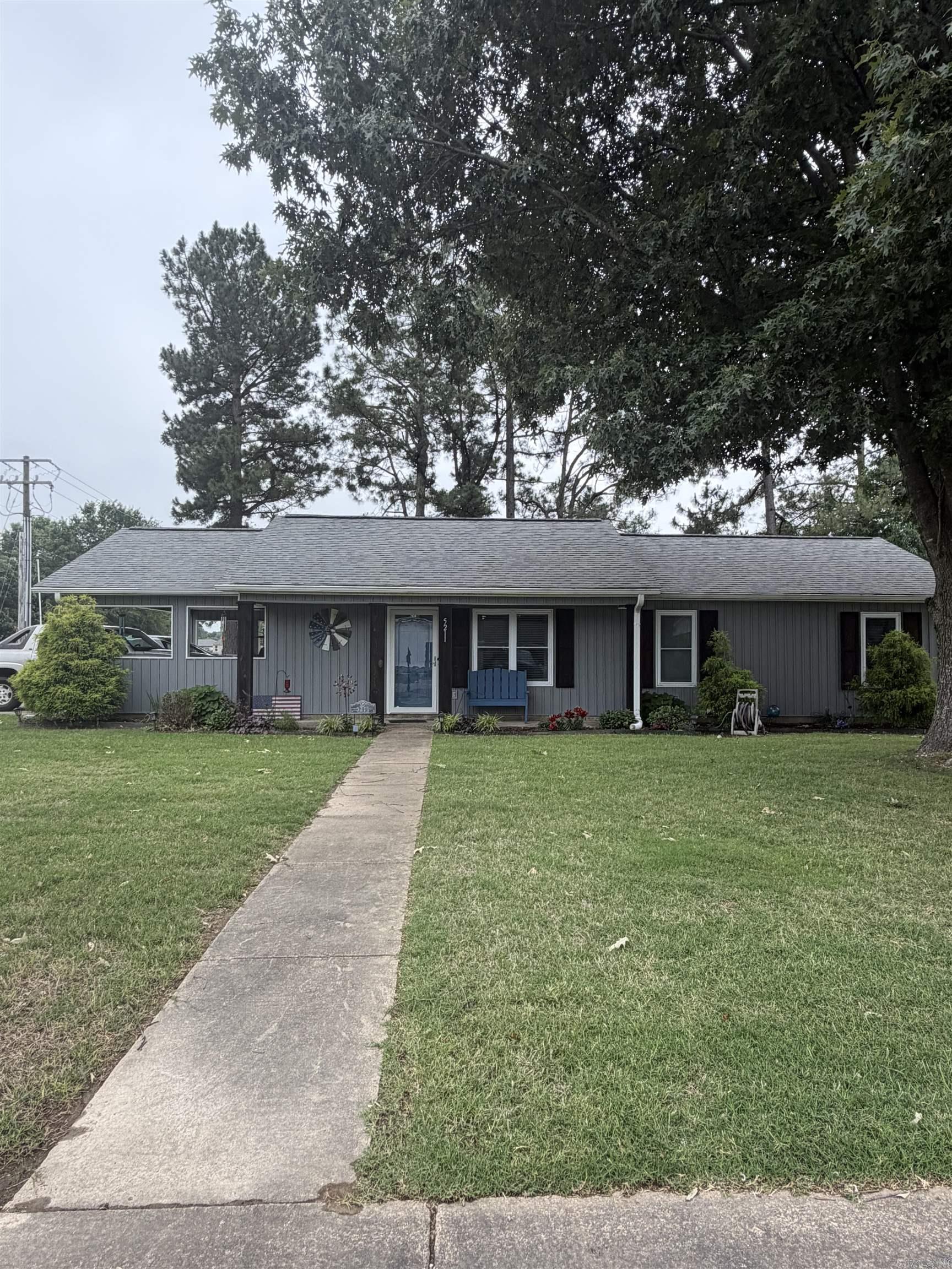Welcome to this beautifully remodeled gem in Jonesboro! Nestled on a corner lot, this home offers a spacious open floor plan with modern updates throughout. Fully renovated just 6 years ago, enjoy a new roof and HVAC, windows, and stylish flooring. The kitchen is a dream with custom cabinets, new appliances, and a center island that stays. Plus, a luxurious custom tile shower and an added 60 sp. ft. of living space. Outside, the cypress wood columns promise lasting charm, the gutters feature a leaf filter, and a storage building in the back offers even more convenience.