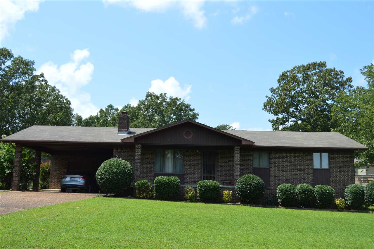 Maintenance free home, all brick, covered back patio, detached shop/storage building with window AC.  Open floor plan.  Breakfast bar.  Back yard is fenced, and has a sidewalk.