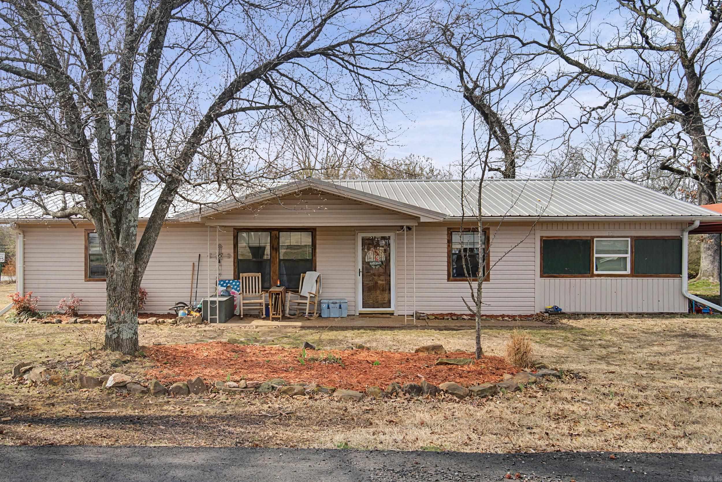 Located within the city limits of Letona, this inviting 3-bedroom, 2-bath home offers flexibility, comfort, and small-town charm. In addition to the main bedrooms, there is an office that can easily serve as a fourth bedroom, guest room, or hobby space to fit your needs. This home features an enclosed carport that is perfect for projects, storage, or creating your own workspace. This charming home is built on a slab foundation and topped with a metal roof, offering long-term peace of mind.  The backyard provides space to relax, entertain, or create your own outdoor retreat. Whether you’re a first-time buyer, downsizing, or looking for an affordable home with extra space and versatility, this great property checks all the boxes. Large carport only conveys. It is conveniently located just 15 minutes from Pangburn and 15 minutes from Searcy. Come tour and make this one yours today!