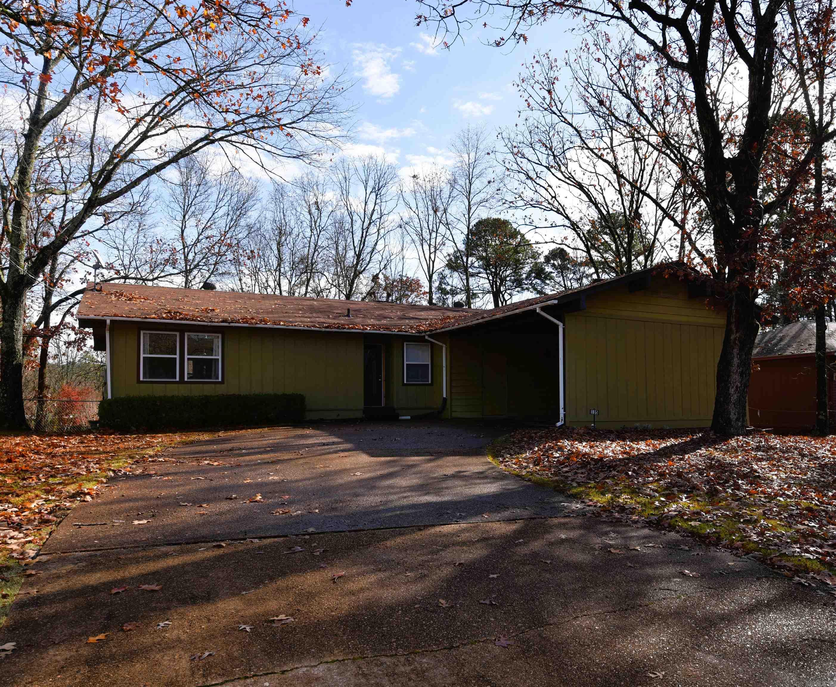 Centrally located in the charming heart of picturesque Fairfield, AR, this well-maintained home is filled with light thanks to its large windows. It boasts newer luxury vinyl plank flooring, insulated windows, a spacious living room, and a split floor plan that separates the primary bedroom from the guest rooms. The dining area sits just off the inviting kitchen, which opens to a covered deck overlooking a generous, fully fenced backyard.  Additional features include ample closet space, a concrete rear slab ideal for grilling, under-deck storage, and an oversized two-car carport with extra storage space. Just minutes from banking, dining, two golf courses, three community pools, pickleball, tennis courts, medical facilities, houses of worship, a bowling alley, miniature golf, shopping and more.  All this plus a full-service marina on pristine Greers Ferry Lake nestled in the foothills of the awe-inspiring Ozarks.