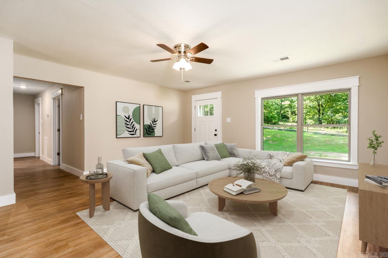 Looking for space, privacy, and a beautifully remodeled home? This move-in-ready home sits on a peaceful one-acre lot surrounded by mature trees, just minutes from Lake Conway and only 15 minutes from Conway with an easy commute to Little Rock.  Inside, you'll find a bright, open floor plan with updated flooring, fresh finishes, abundant natural light, and a remodeled kitchen featuring stainless steel appliances, tile backsplash, and a large walk-in pantry. One bedroom offers the flexibility to serve as a home office, guest room, nursery, or hobby space.  Enjoy peace of mind with a brand-new 2026 roof and an HVAC system replaced within the last few years. Propane backup heat provides an additional heat source during winter power outages. Outside, enjoy the freedom of a full acre with room to garden, entertain, or simply relax beneath the shade of mature trees.  Conveniently located just 1.5 miles from I-40, this home offers the perfect blend of peaceful country living with quick access to Conway, Little Rock, shopping, dining, and recreation.  Schedule your private showing today!