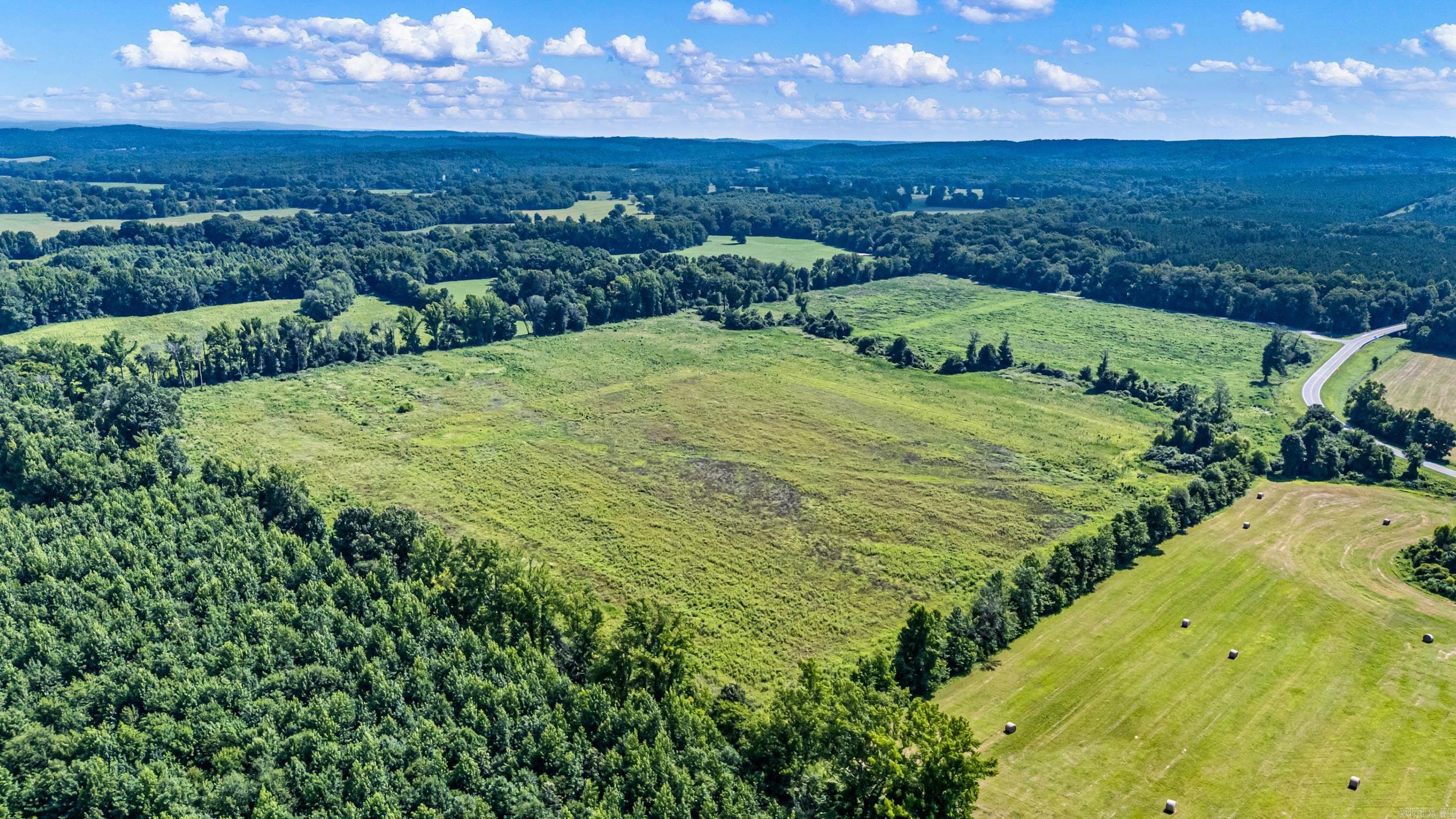 66.43+/- acres of prime crop land with highway frontage! Exceptional opportunity to own a piece of productive farmland on Hwy 247/Griffin Flat Road. This versatile property has been farmed in the past with planting corn and soybeans, making it an excellent investment for agricultural use. Located within a flood zone, the property benefits from natural irrigation, providing an advantage for growing crops. In addition to its farming potential, the acreage offers outstanding recreational opportunities and could be an ideal destination for duck hunting thanks to its natural water features and wildlife habitat.