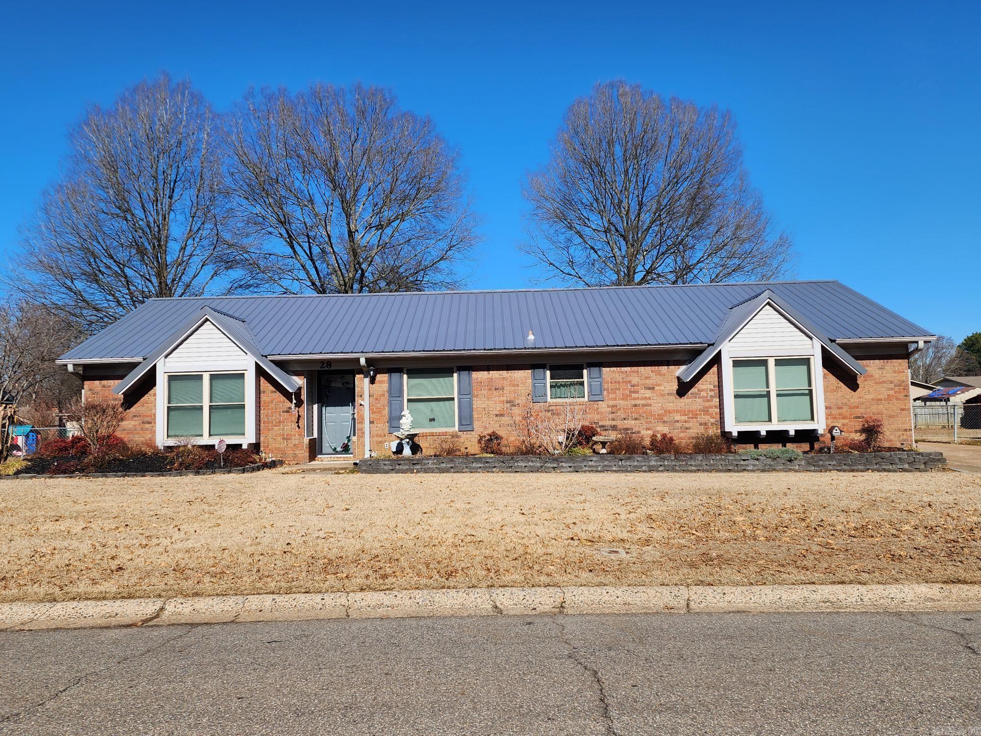This all-electric house has a lot to offer with an added 12x20 sunroom, 8x8 storage building, 8x20 shop/utility building with electric. There is also a fenced in back yard with concrete drive extending into back yard. The house has been updated with a metal roof & Trane heat & air units. it has a split floorplan with the living room opening up to the sunroom on the back & the kitchen & separate dining room on the front. The living room also has a built-in fireplace. The master bath has a walk-in closet, separate make-up vanity & a stand up shower. The house is in process of Estate Sale. Please call for appointment. Agents, please see remarks.
