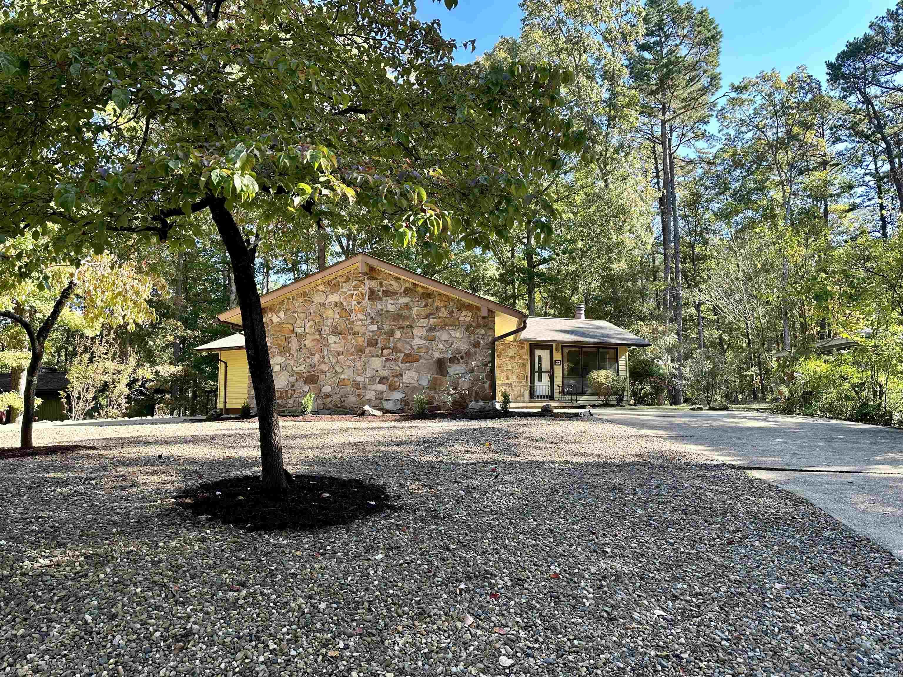 On a safe cul-de-sac, and beautifully situated on a great size lot w/new landscaping & power-washed U-shaped driveway, sits a Cozy Cottage w/ an updated fireplace & lots of natural light in living, dining & kitchen area. Ample storage throughout w/newer fridge, washer & dryer to convey. The screened in porch extends your living area while the insulated large workshop w/window easily serves multiple purposes —  This affordable real property is ideal for either a small family, couple or single individual, for owning or renting, both long or short term.  With low maintenance, this is an ideal investment property! /Welcoming  curb appeal!