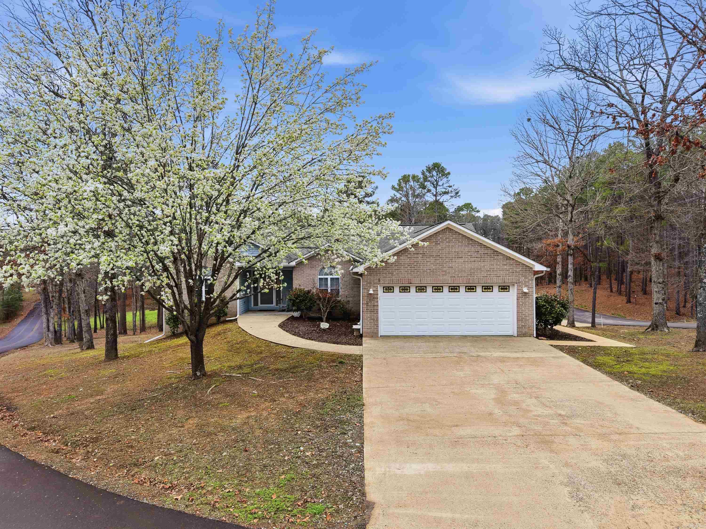 Located less than 1/2 mile from Devil’s Fork Recreation Area on beautiful Greers Ferry Lake, this beautifully maintained home offers the perfect combination of lake living, recreation, and investment potential. Enjoy quick access to the boat launch, swimming area, and campground, making lake days simple and convenient.  Inside, the home offers great flexibility with a fully equipped lower level kitchen, ideal for guests, multi-family living, or possible Airbnb/short-term rental use. The main level features a spacious laundry room and a dedicated office, perfect for working from home or extra living space. Heat & air is less than two years old.    Outside, a large 24' x 32' detached shop provides plenty of room for boats, lake toys, ATVs, or workshop space. The property is also just minutes from marinas, golf courses, and popular ATV/UTV trail systems, making it a great base for year-round outdoor adventure.  Additional highlights include a low-maintenance exterior and a saferoom for added storm protection. Whether you're looking for a full-time home, weekend lake retreat, or investment property near Greers Ferry Lake, this property offers location, versatility, and lifestyle.