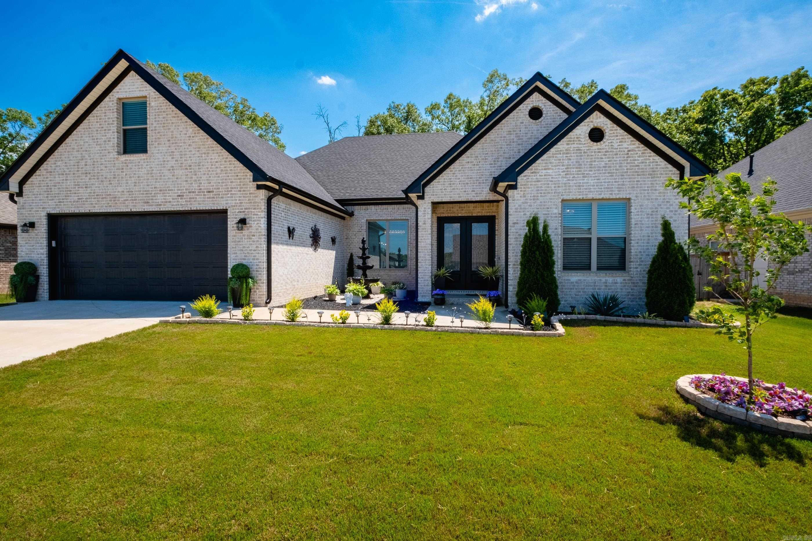 Tucked away in beautiful Maumelle & backing to serene green space, this vibrant home offers the perfect blend of luxury, comfort, & thoughtful design. Skip the hassle of building—these sellers have already thought of everything. Inside, you’ll find a spacious one-level layout w/ soaring ceilings, a desirable split floor plan, upgraded finishes, and hard-surface flooring. A professionally landscaped front yard, with a tranquil fountain that creates an inviting first impression. The home is filled w/ natural light and a spacious, open floor plan. It features ample cabinet space, generous walk-in closets, & high-end finishes at every turn. Step outside to your private retreat—an incredible screened-in back patio with remote-controlled screens, allowing you to enjoy the outdoors year-round. The fence frames the peaceful green space behind, offering privacy. Unwind in the spa hot tub, complete w/ a brand-new overhead cover so you can relax in any weather—rain, sun, or even snow. With an acceptable offer, the hot tub conveys. This is more than a home—it’s a lifestyle. Once you step inside, you won’t want to leave this charming Maumelle Oasis!