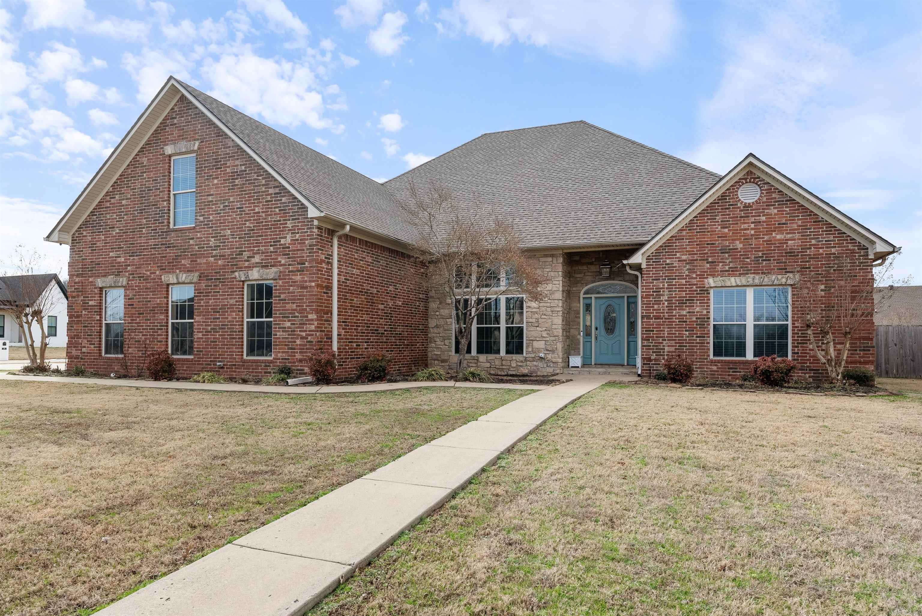 This stunning 5 bedroom 3.5 bath home has plenty to offer everyone in the family! Sitting on almost half an acre corner lot in Quail Hollow, you will find an amazing great room with a vaulted wood ceiling, a huge rock fireplace and custom built-ins. There is a formal dining with beautiful windows, an absolutely charming eat in  kitchen with brick floors, a gas cooktop, double ovens, island and breakfast bar.  The spacious master has double tray ceiling, his and her closets, jetted tub and separate shower. There are 3 other bedrooms downstairs with jack and Jill bath.  Upstairs you will find a loft area perfect for hanging out, a bedroom, an office/flex room and a full bath. There is also an amazing game room/ theatre room with separate access and plenty of space for game nights. Extra driveway provides parking for guests, or even an RV. Roof replaced Dec 2024!!!