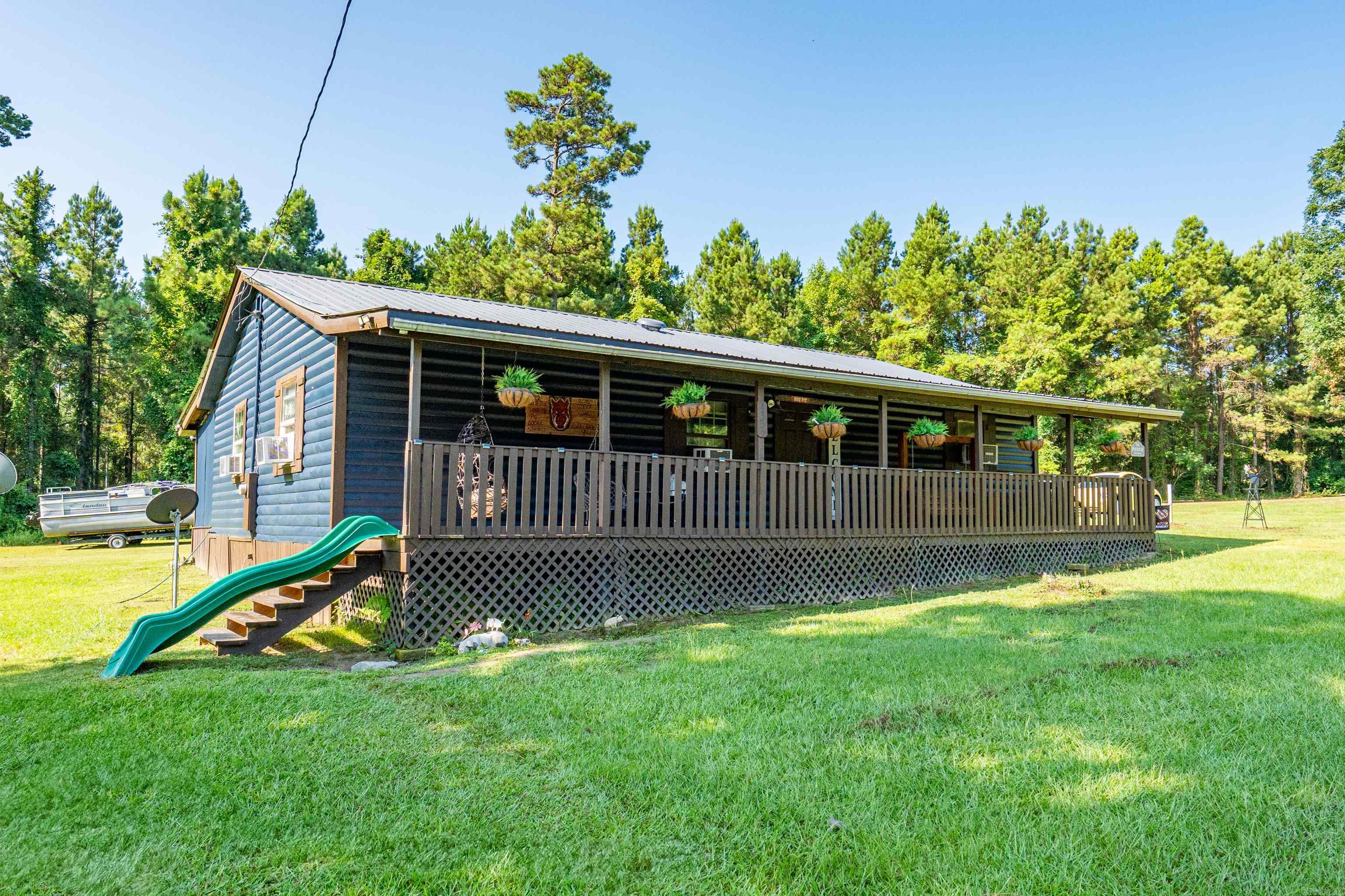Country Charm Meets Modern Updates! Welcome to peaceful country living! This beautifully updated 3-bedroom, 1-bath home sits on approximately 1 acre and is full of charm and character. From the inviting full-length front porch to the striking dark blue painted lodge-style wood siding, this home offers exceptional curb appeal and a warm, welcoming feel. Inside, you’ll find updated flooring throughout, a spacious eat-in kitchen, and a versatile bonus room that can serve as a playroom, home office, hobby room, or whatever best fits your lifestyle. Step outside and enjoy everything this property has to offer, including a chicken coop, storage building, and a fenced area that’s perfect for a future garden. There’s plenty of room to enjoy the peace and privacy of country living while still having space for your hobbies and outdoor activities. Major improvements include a new roof (2023), new water heater (2026), and extensive well updates with new pipes, tank, and water lines. The septic system was pumped in 2020, providing added peace of mind. If you’re looking for a move-in-ready home with character, thoughtful updates, and room to enjoy the outdoors, this country property is the one!