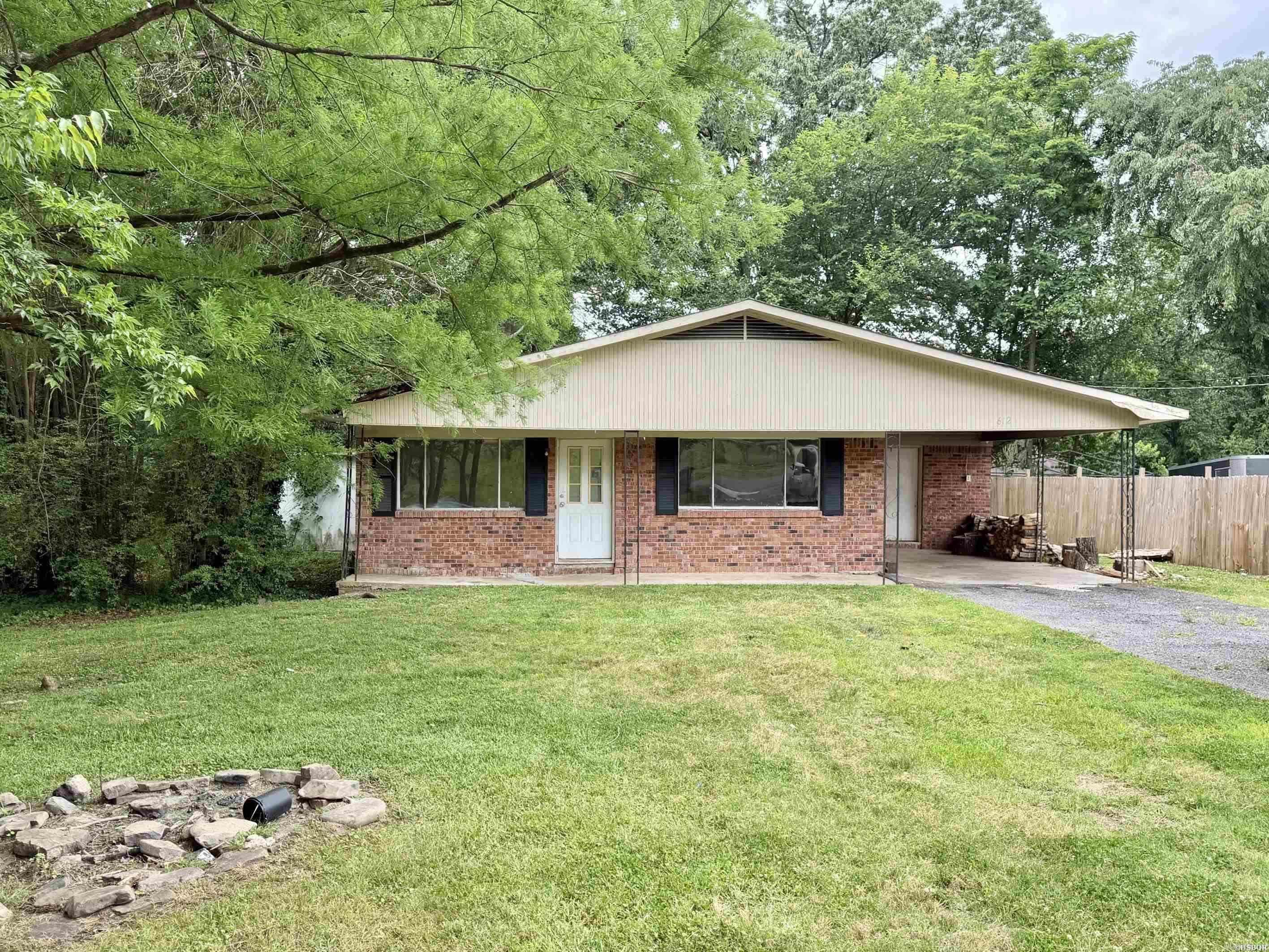 Affordable homes with upside are getting harder to find—and this one still has plenty of room to make money or make it your own. Located along Trivista Right near Oaklawn Casino, this one-story brick home sits at the end of a quiet street with very little traffic. The home features 3 bedrooms, 2 baths, a large lot, laundry room and an extra living area with a woodburning fireplace that could easily work as a 4th bedroom. Does it need cosmetic updating? Sure. But that’s half the fun… and all the opportunity. Whether you’re an investor, flipper or a just buyer looking for a home that won't break the bank, this one is definitely worth a look.