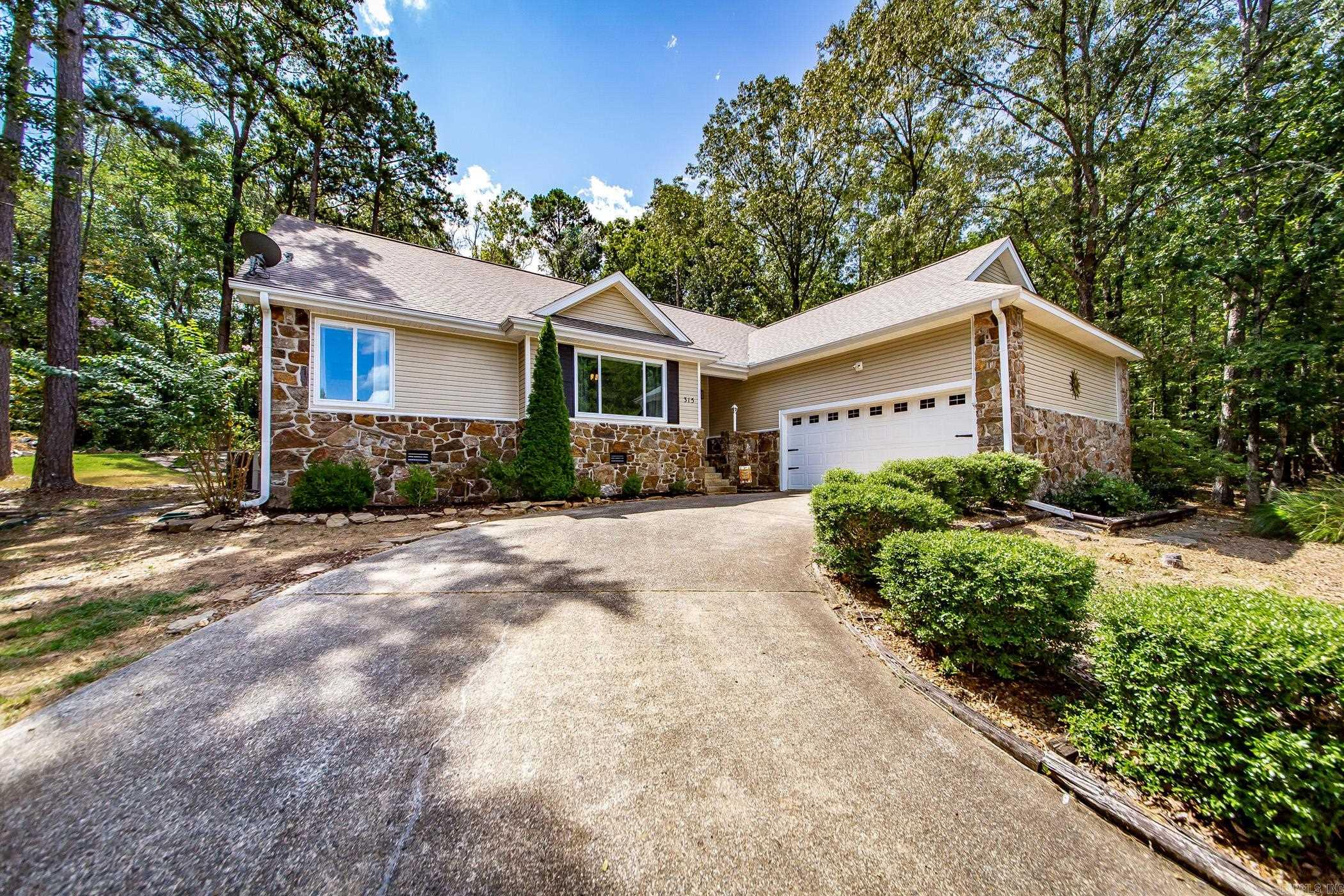 Welcome to 315 Mountain Ranch Drive - a rare opportunity to own a beautifully updated golf-course home in one of Fairfield Bay’s most desirable & exclusive areas.Perfectly positioned on a private 1+ acre tract w/direct frontage on the 18th hole of Mountain Ranch Golf Course, this property offers a combination of privacy, scenery, & lifestyle that is difficult to find in today’s market.This well-maintained 3-bedroom,2-bath home offers approximately 1,960 square feet of comfortable living space & has been thoughtfully improved to enhance both style & function. Recent updates include interior improvements that give the home a fresh, move-in-ready feel while still allowing the next owner to enjoy the character & setting that make this property so special.Inside, you’ll find a bright & inviting layout w/spacious living areas, large windows, & beautiful views of the golf course plus surrounding natural setting.The home flows well for full-time living, retirement, or a second-home retreat.The kitchen, living, & bedroom spaces are designed for comfort & practicality, while the overall setting creates the feeling of a peaceful Ozark getaway.(See "Docs" for cont'd info on the home/property)